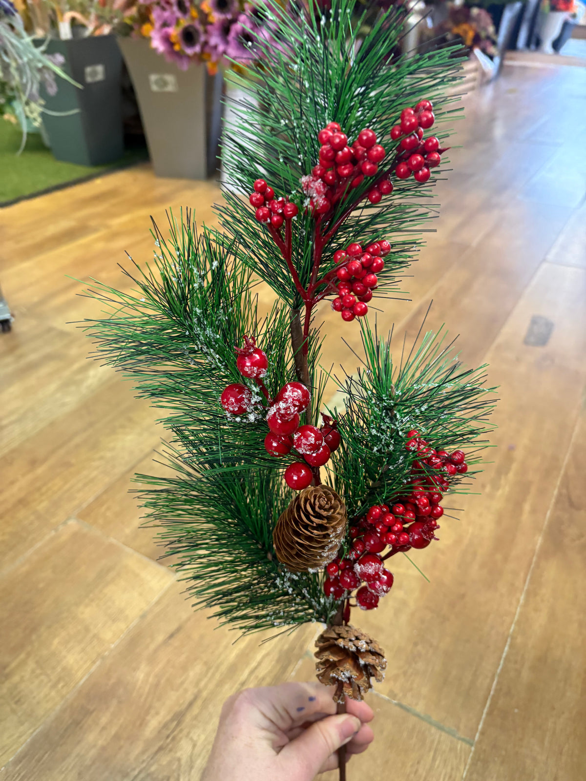 Long stem frosted foliage wi5 cones and mixed berries