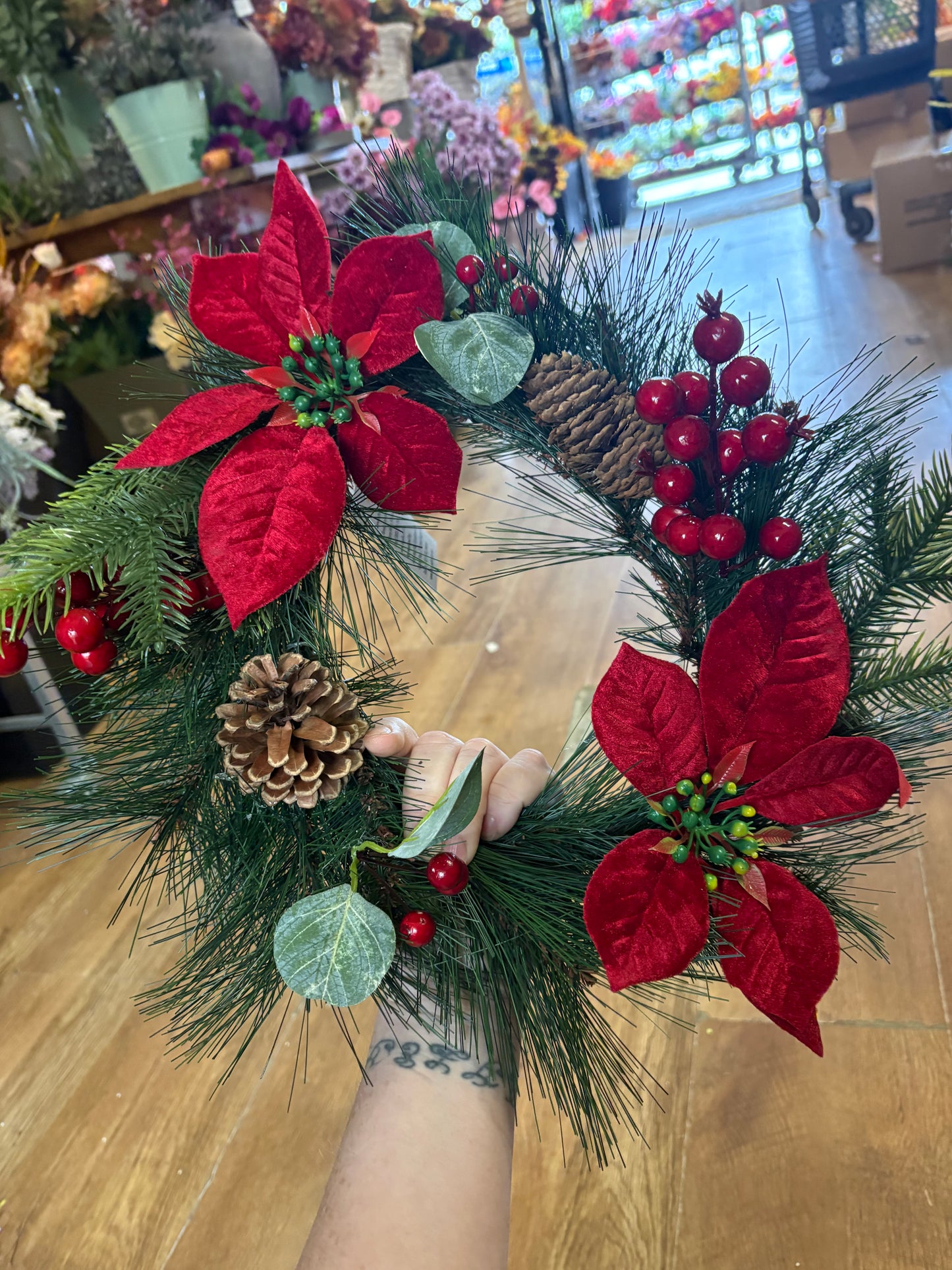 Poinsettia and red berry wreath (40cm from tip to tip)