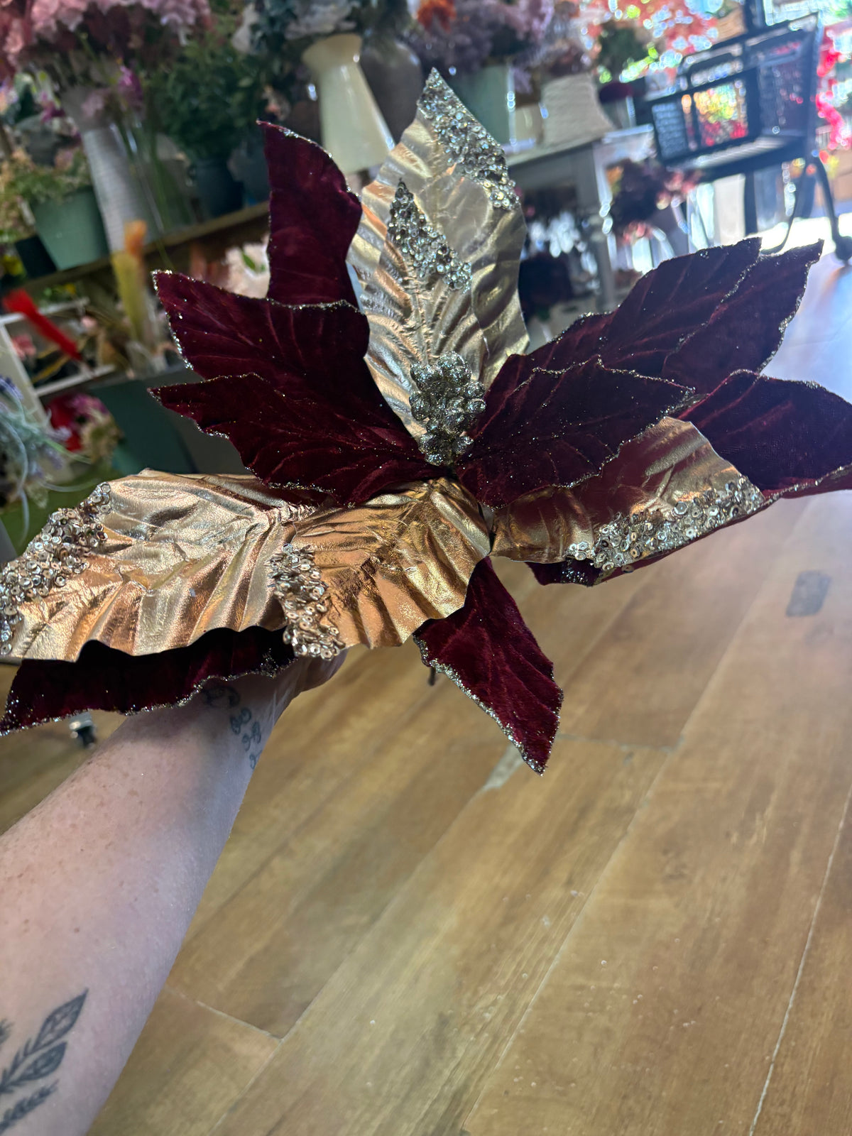 Large burgundy velvet and metallic gold poinsettia