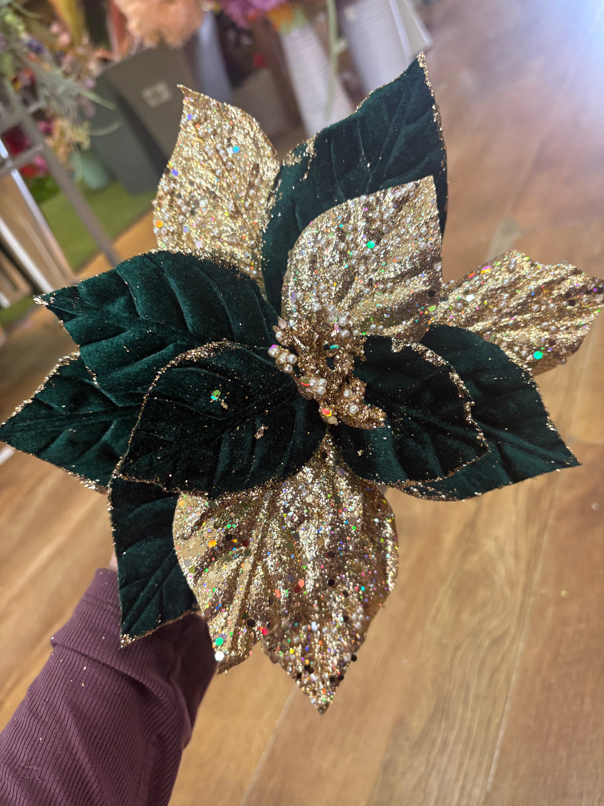 Short stem green velvet and gold glittered poinsettia with pearls