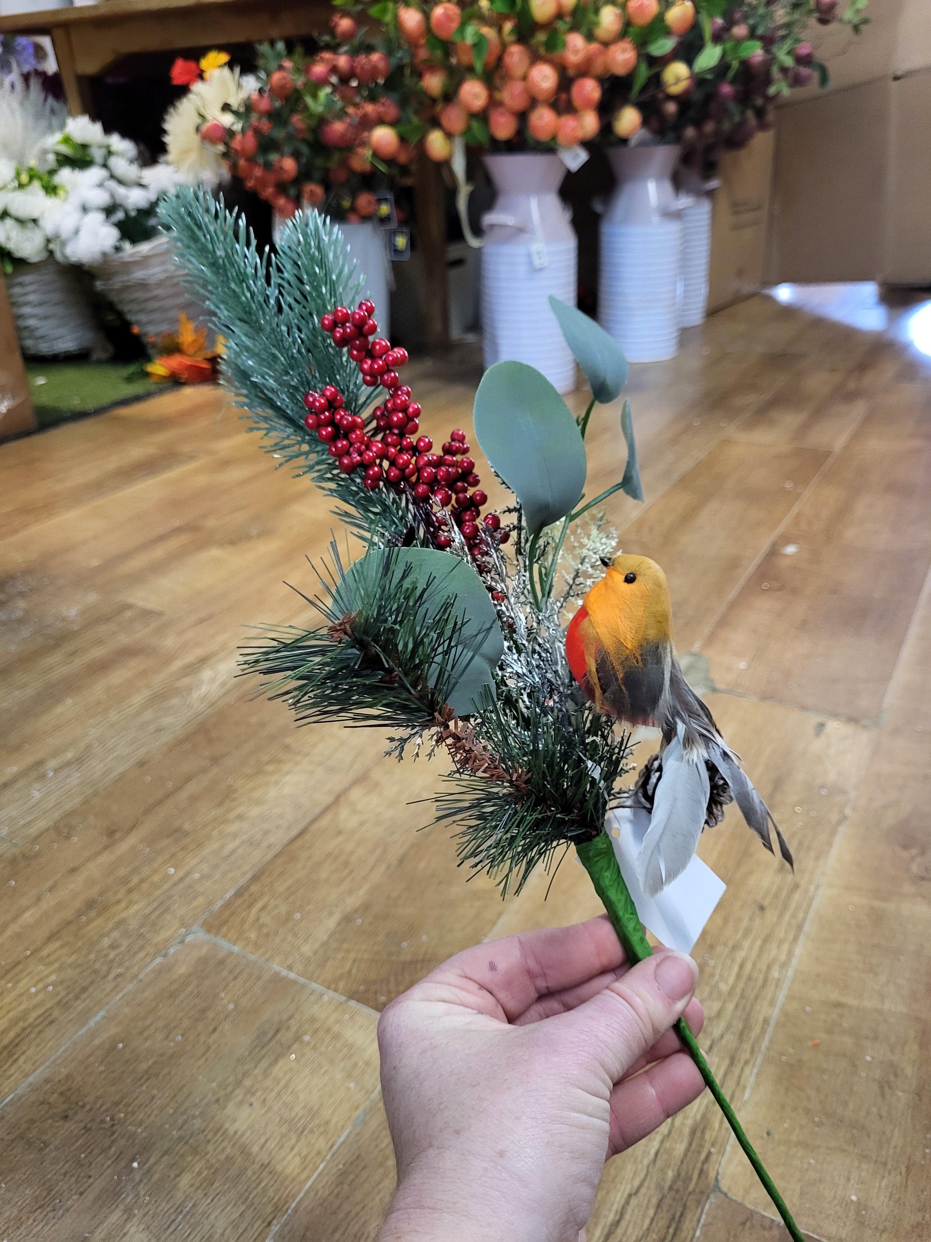 Mixed winter foliage and berry branch with a Robin image 0