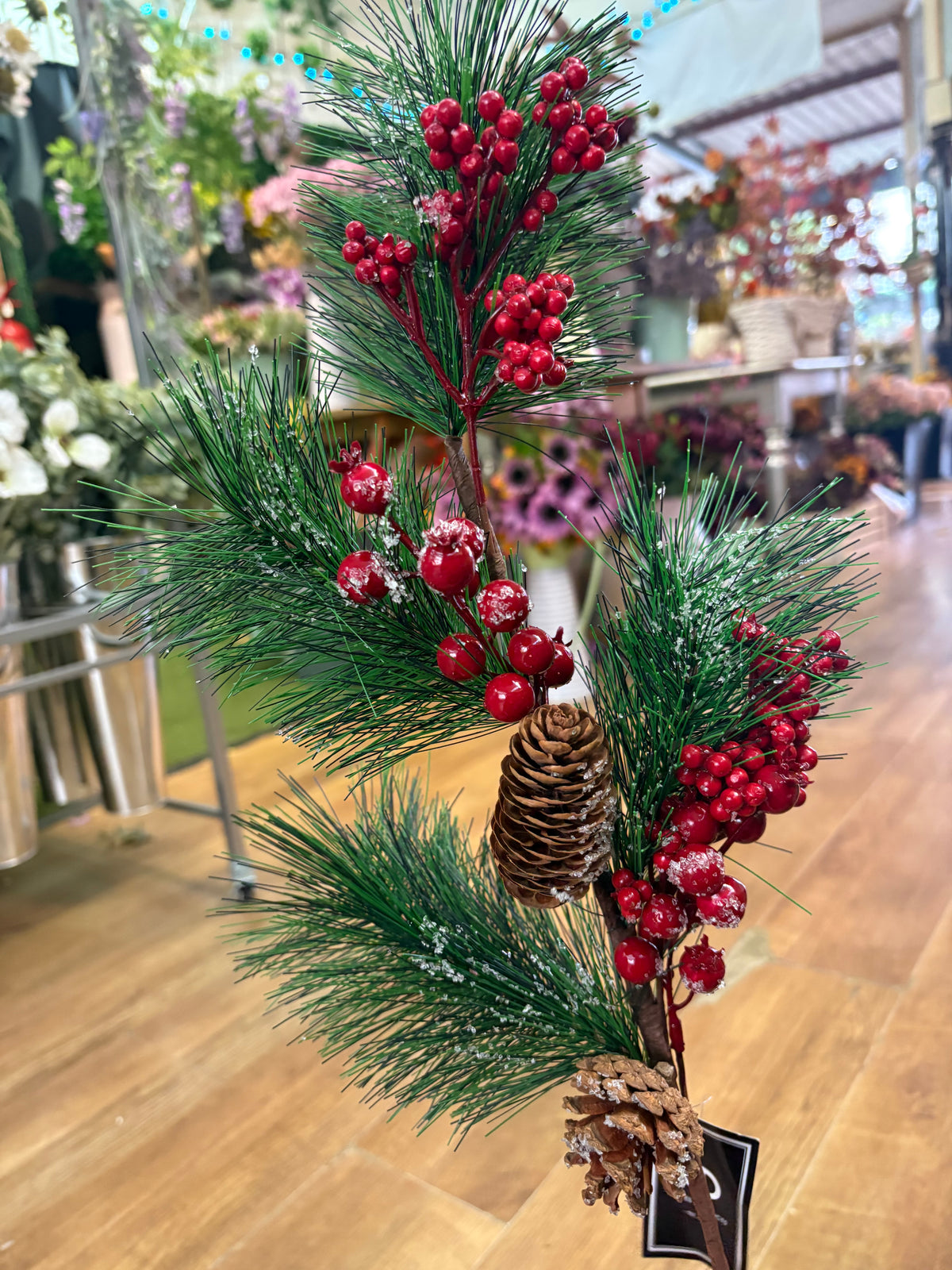 Long stem frosted foliage wi5 cones and mixed berries