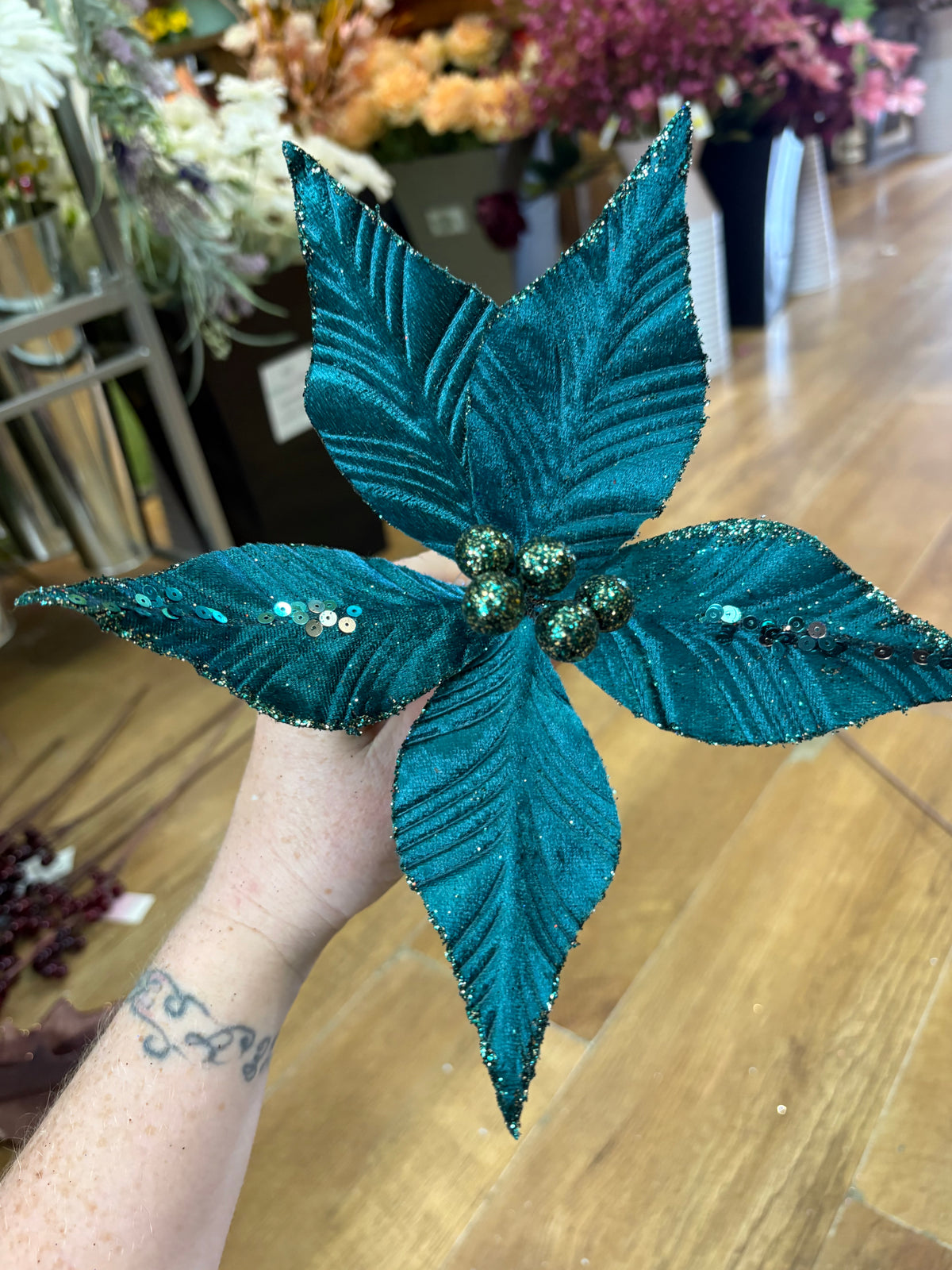 Single teal velvet and glitter poinsettia