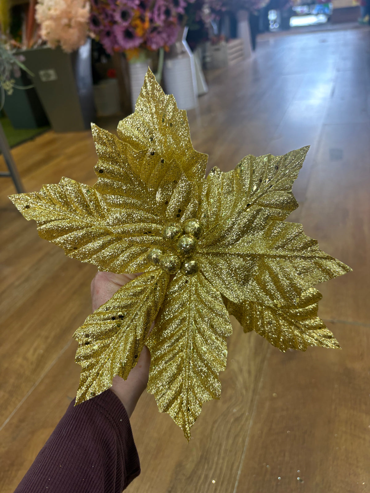 Short gold glittered poinsettia