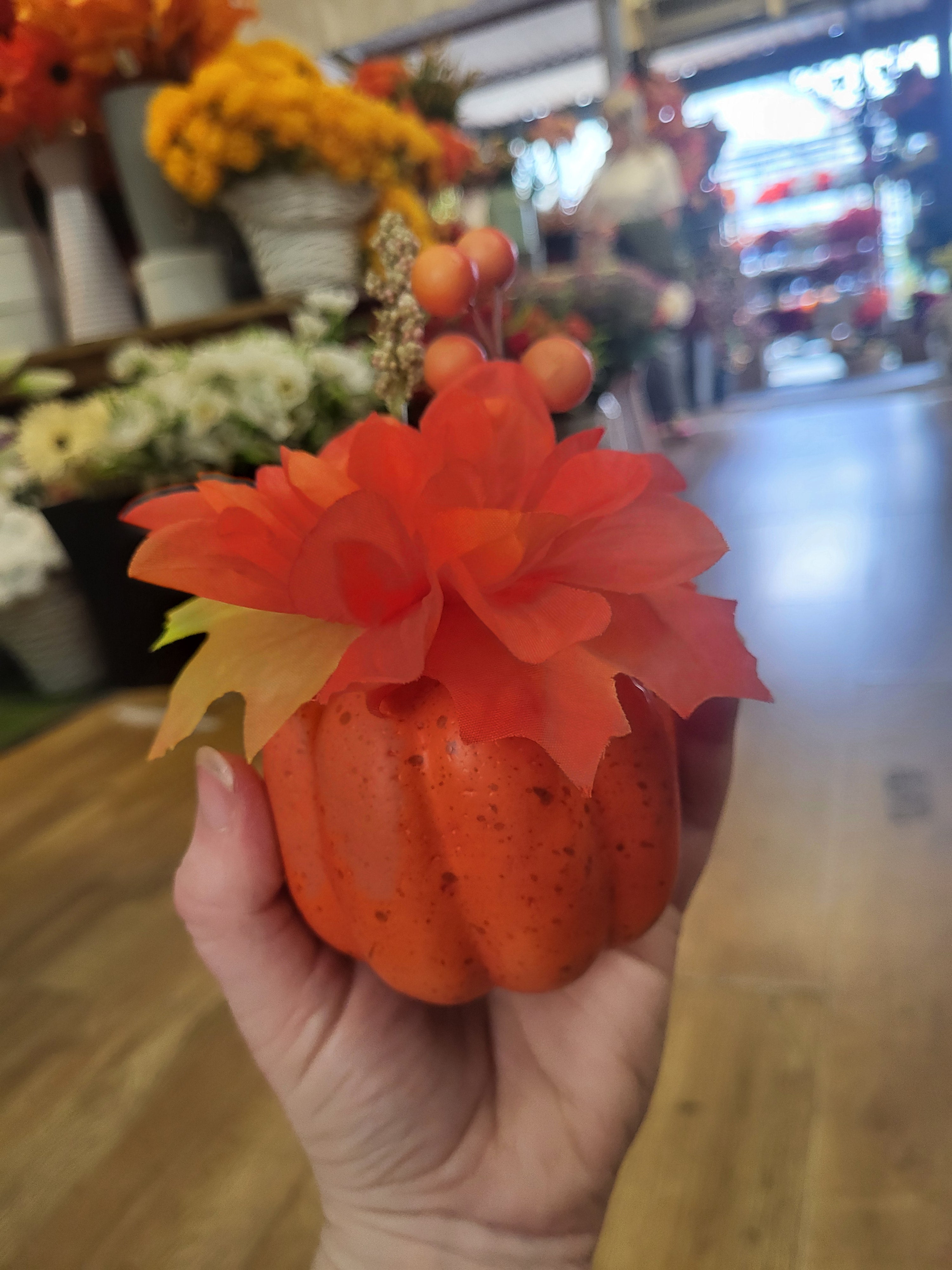 Small decorated pumpkin with orange flower image 0