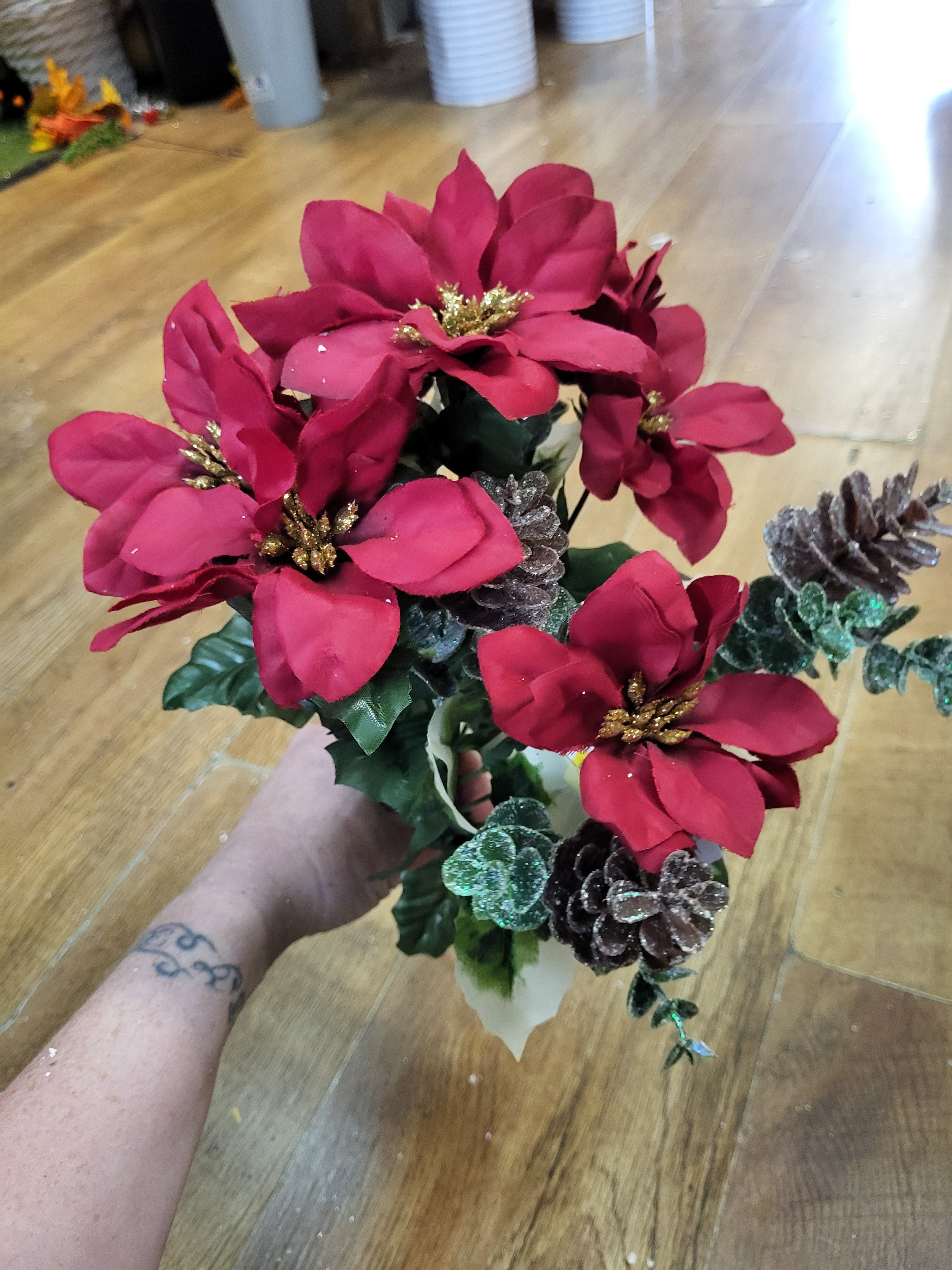 Red poinsettia and frosted cone bunch  image 1