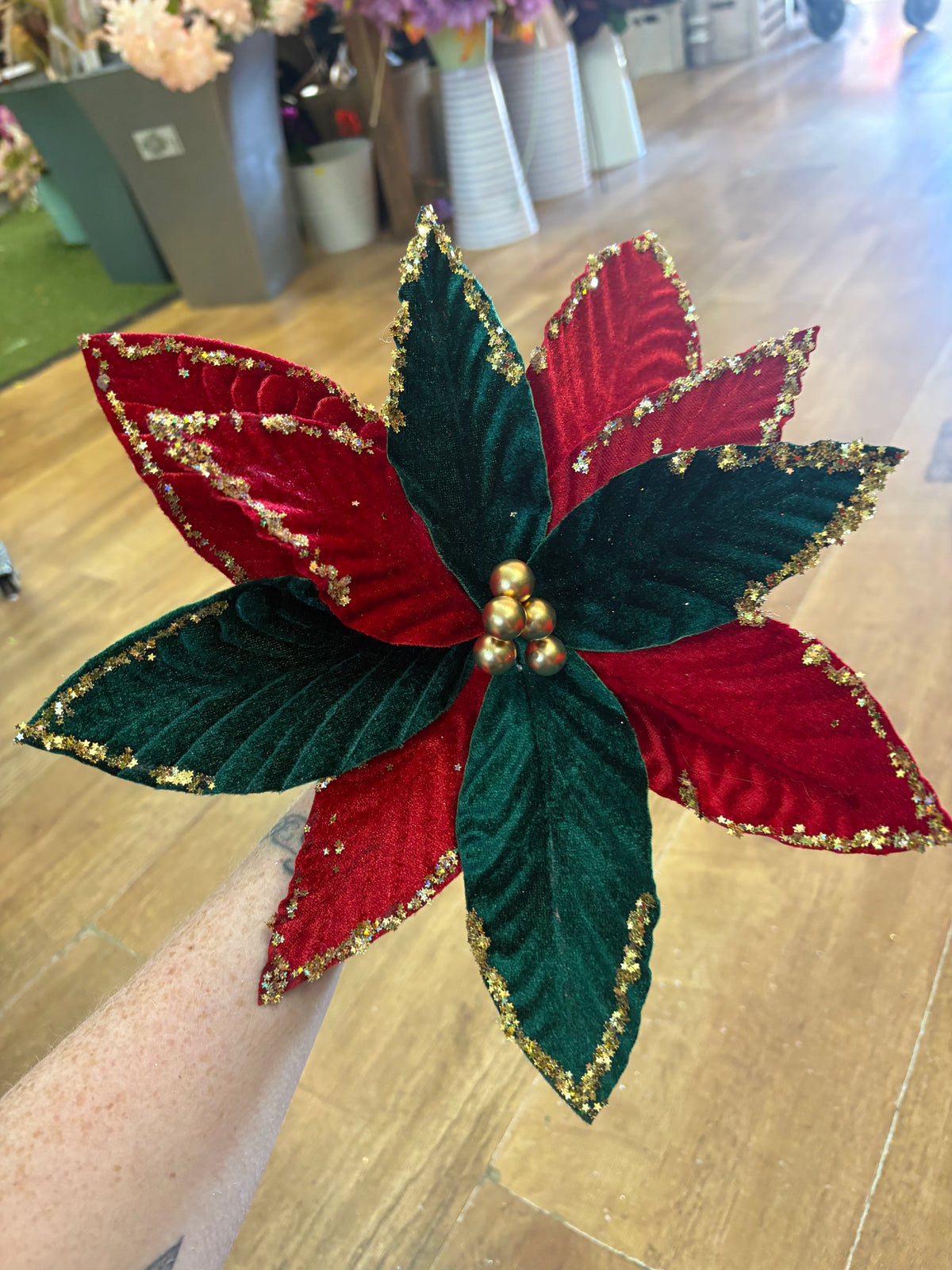 Red and green velvet and gold glittered poinsettia