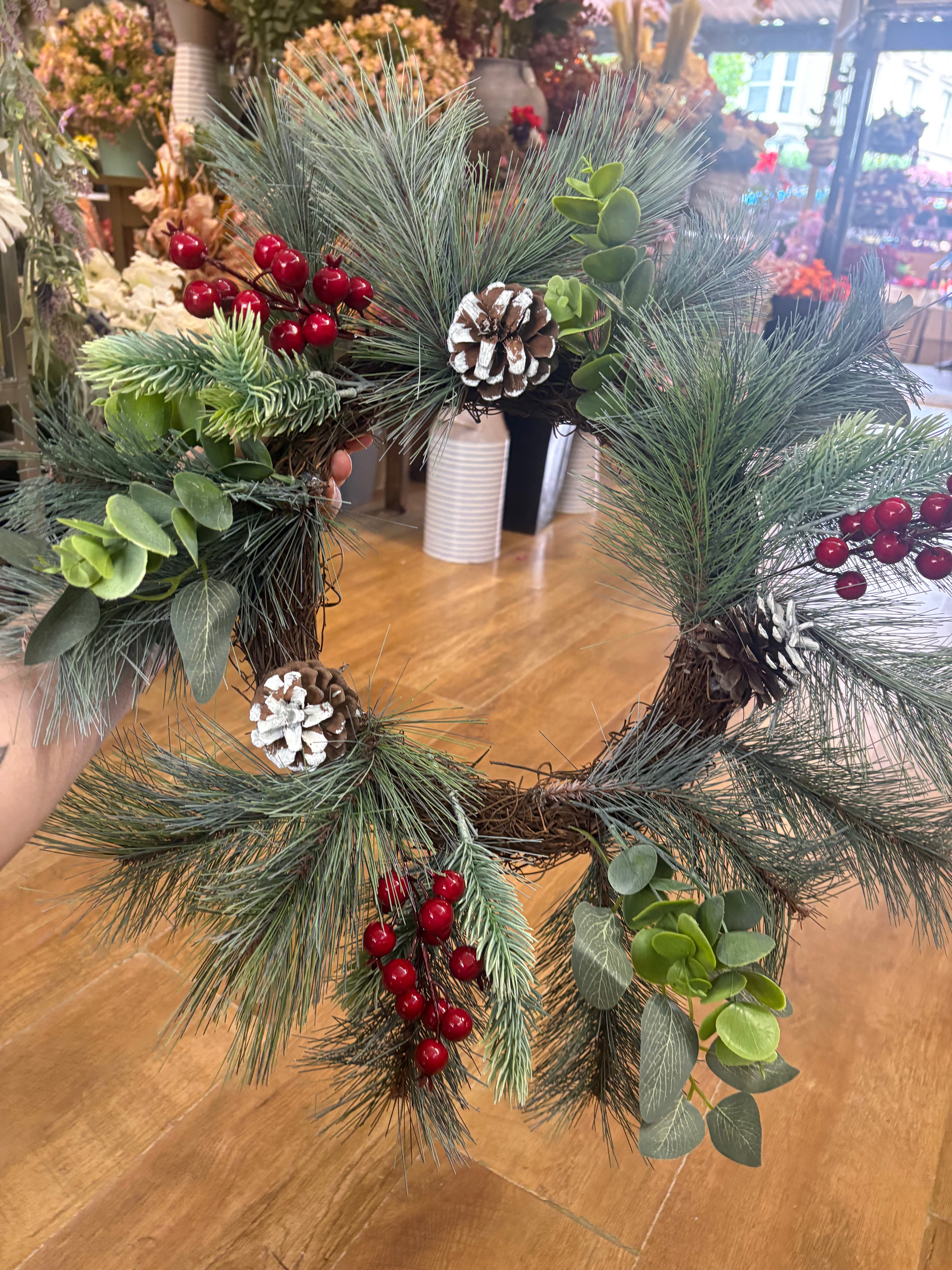 50cm frosted cone and berry wreath (measured tip to tip)