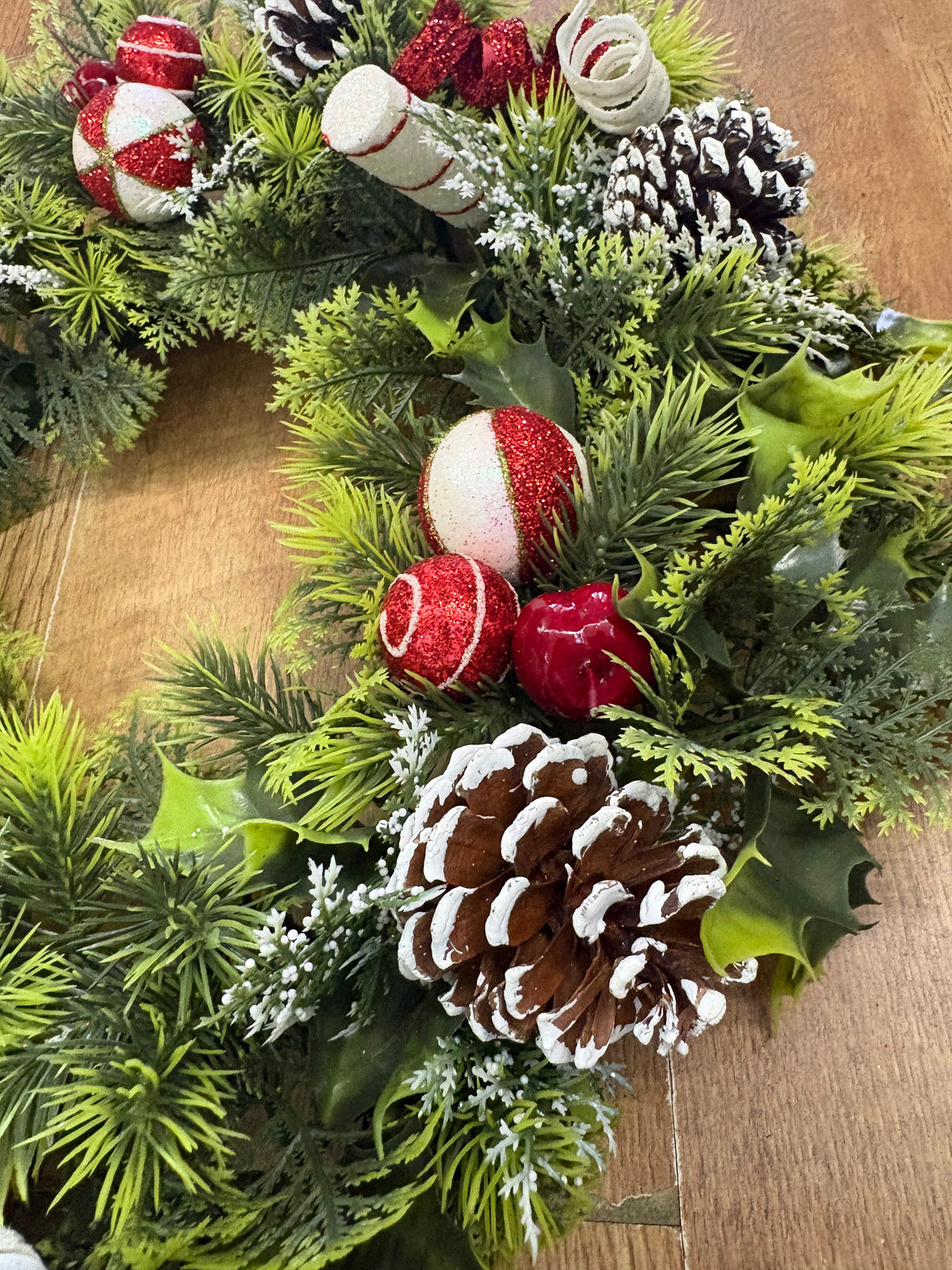 18” wreath with candy baubles, swirls and cones
