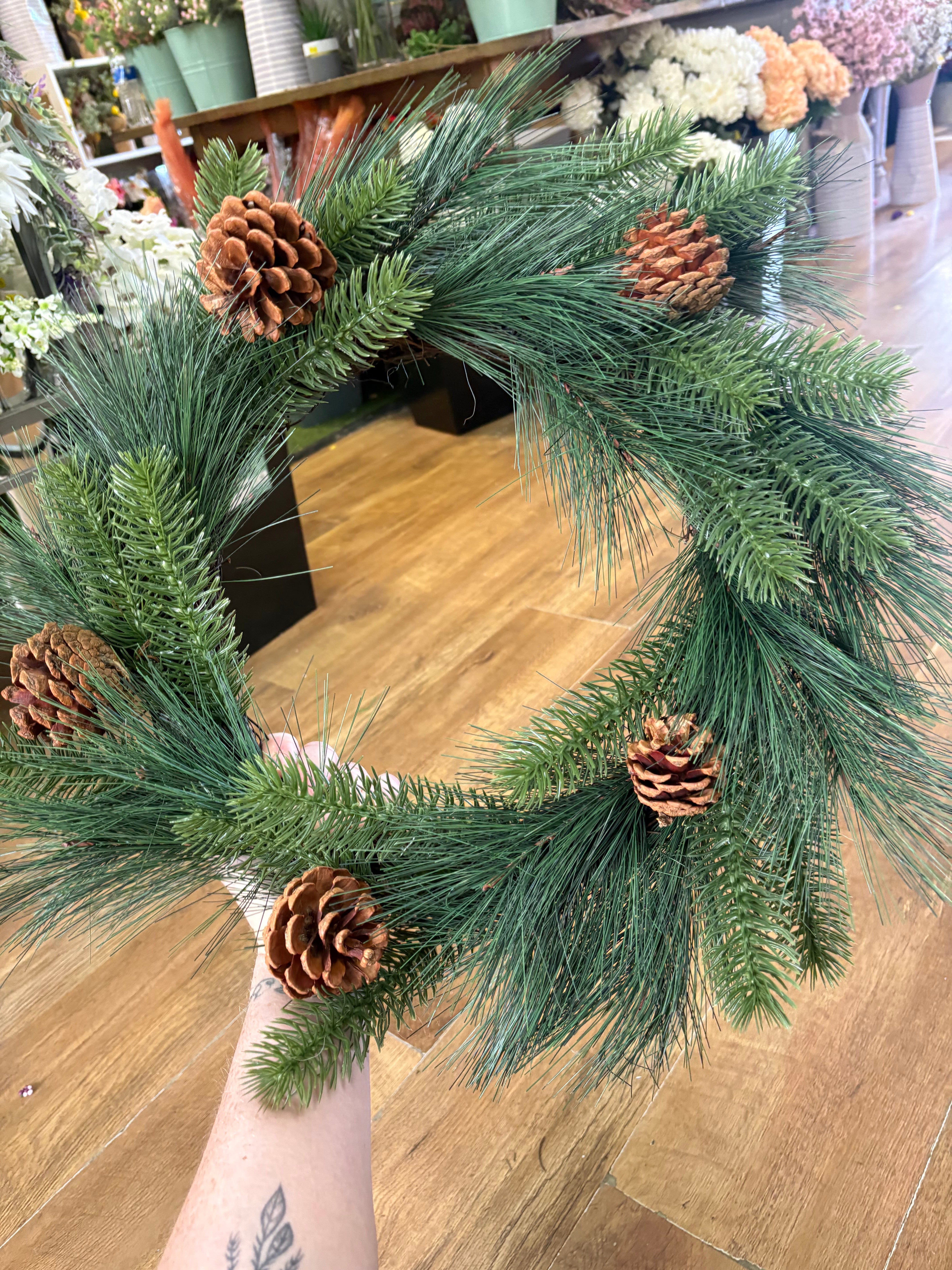 55cm mixed pine and spruce with cones wreath on grapevine base