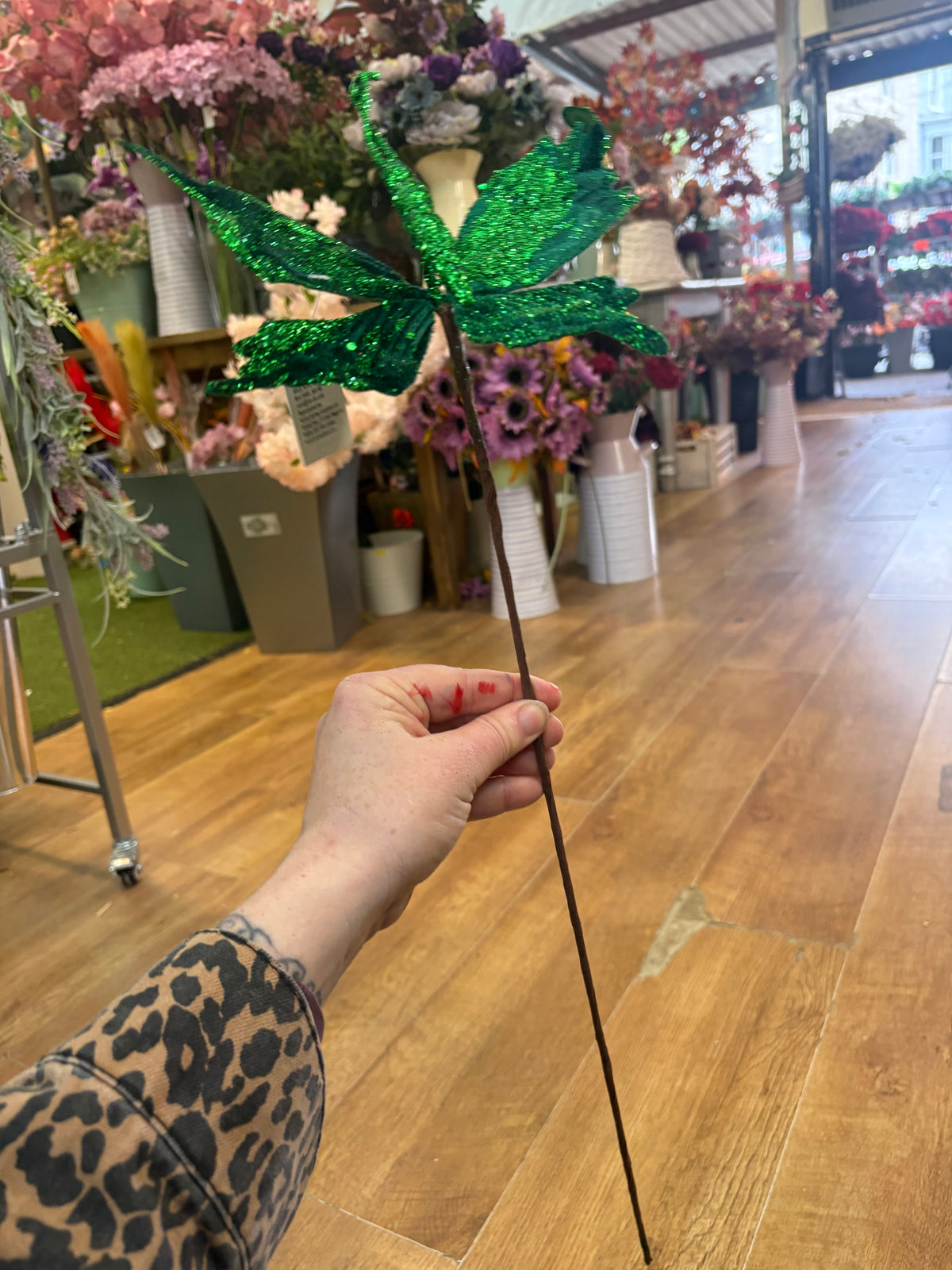Long stem green velvet and glitter butterfly
