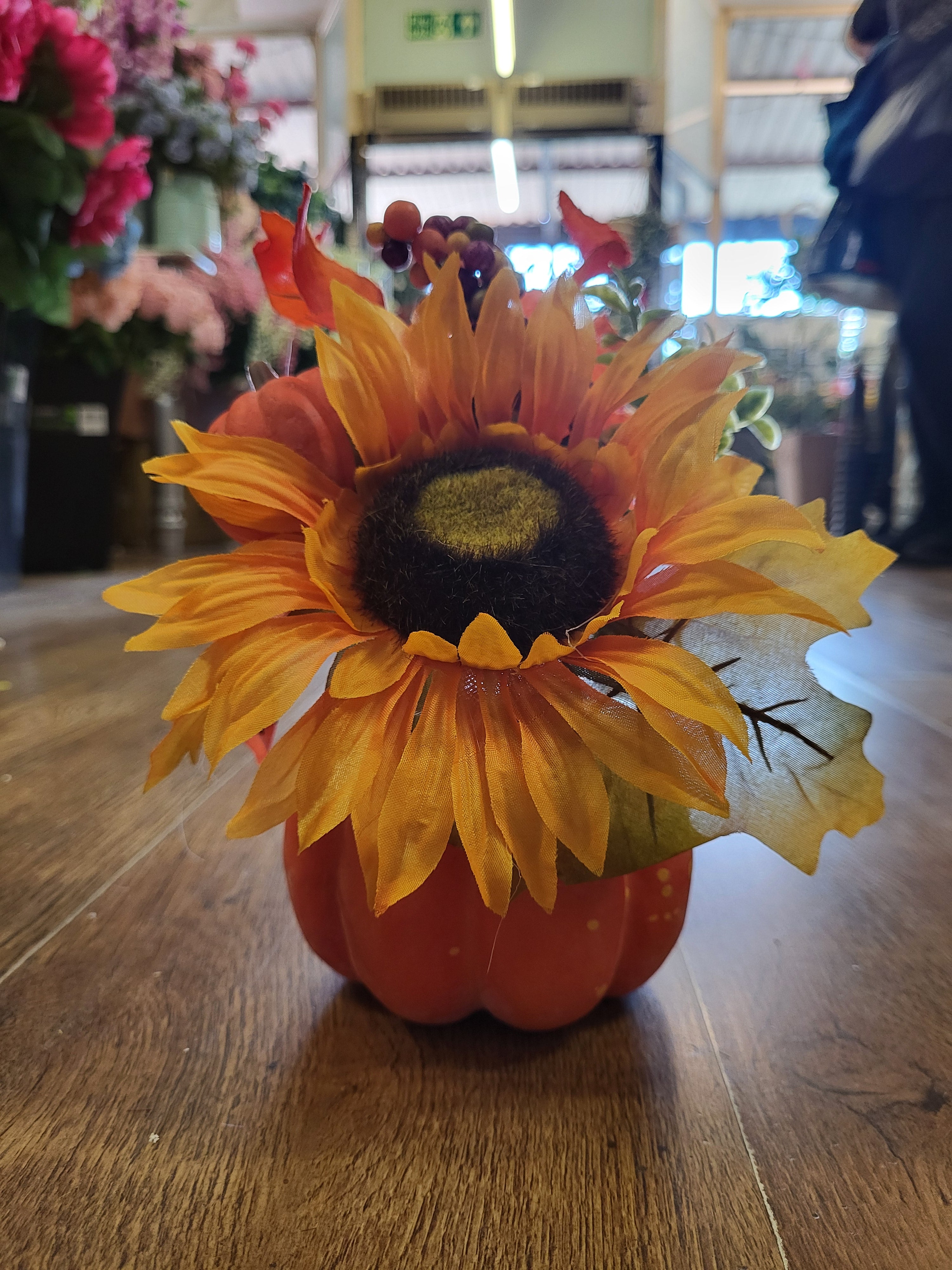 Sunflower/berry/foliage in pumpkin display  image 2