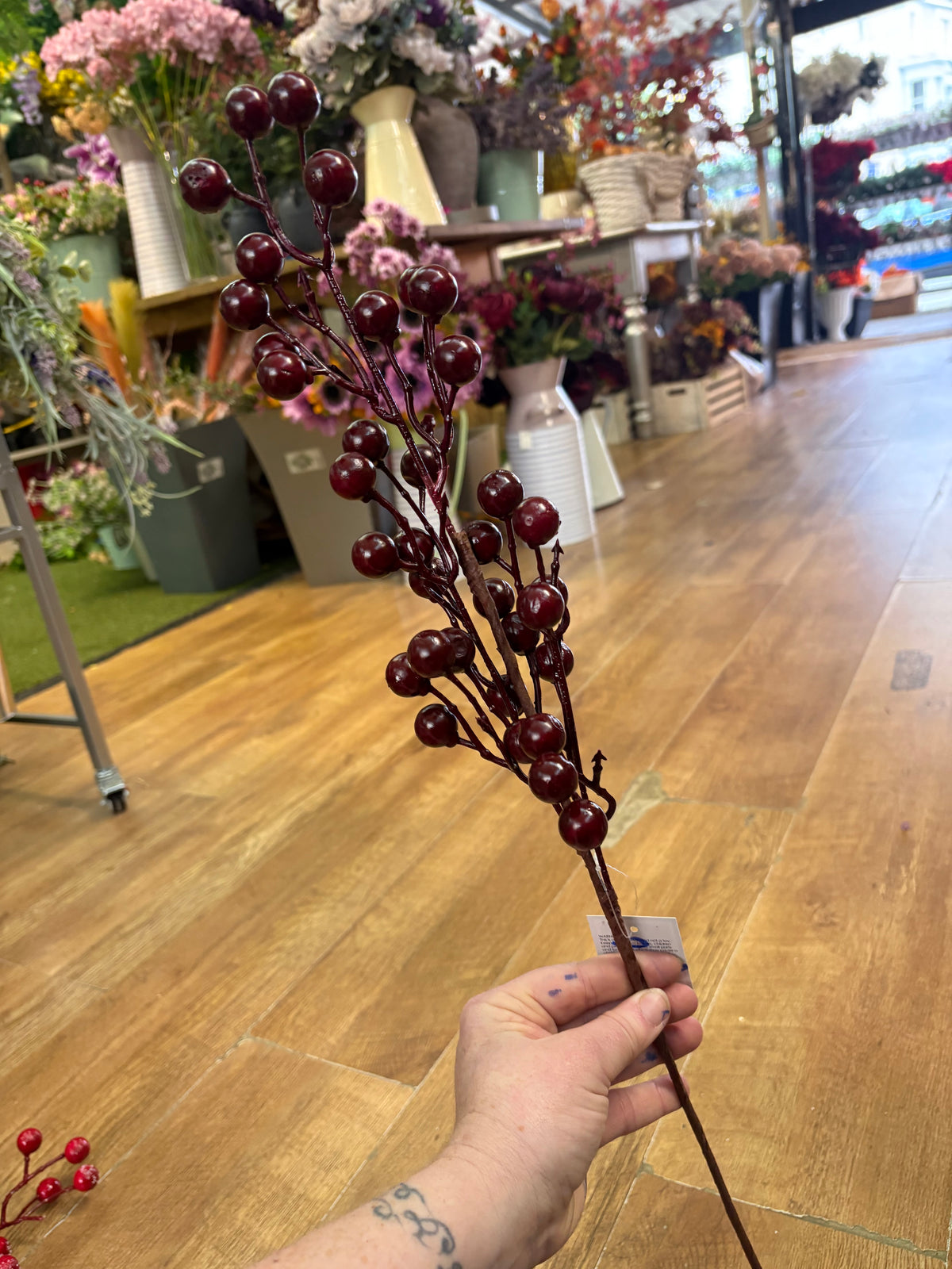 Long stem deep burgundy berry spray