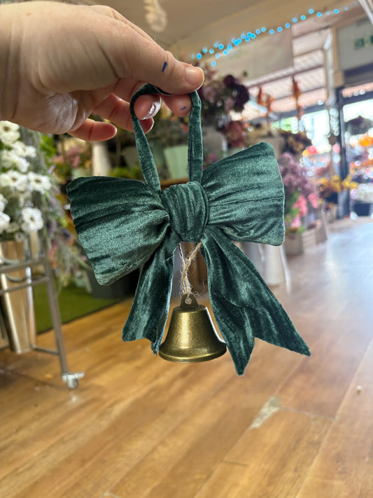 Small hanging green velvet bow and Christmas bell