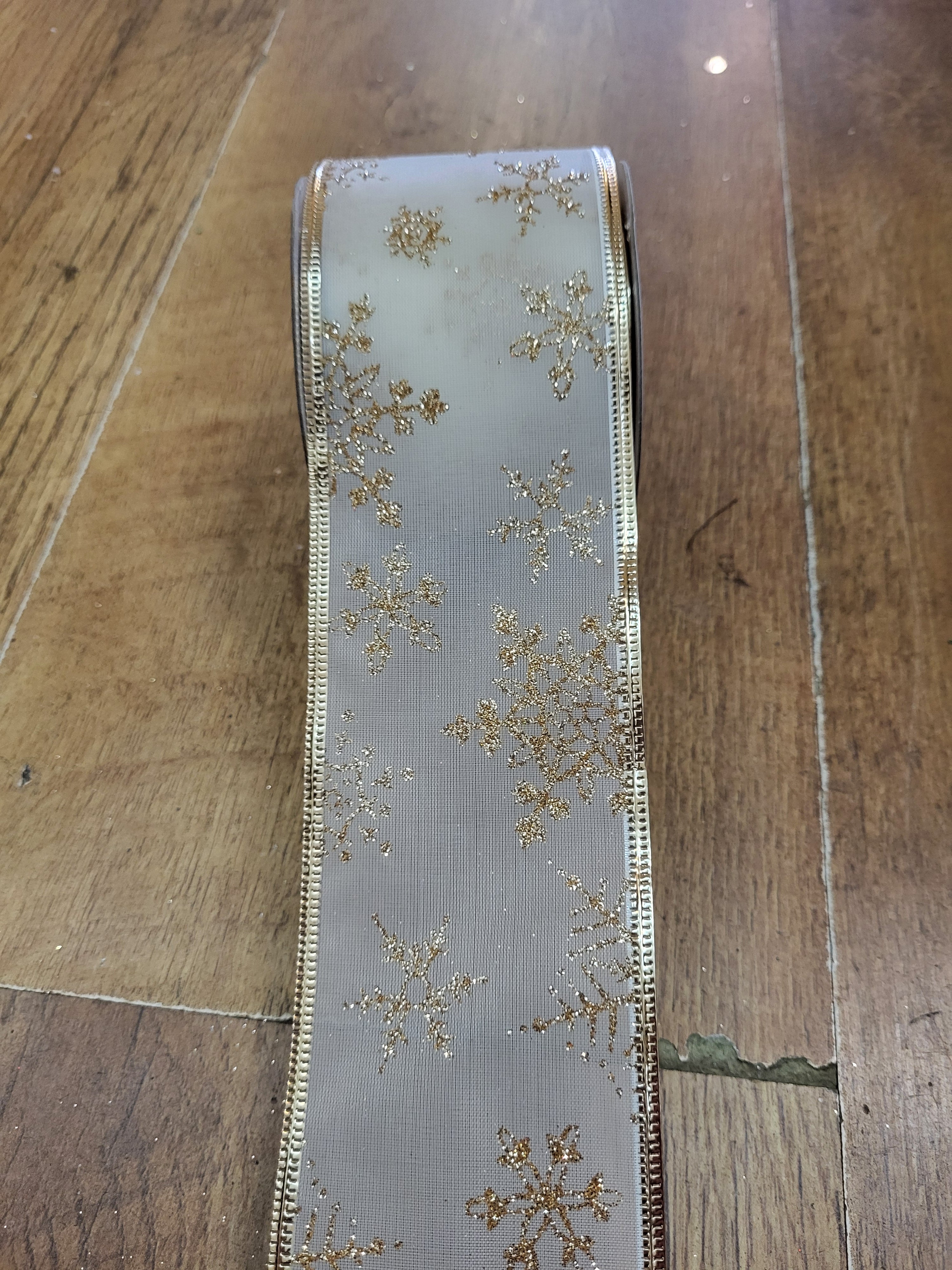 2.7m approx. roll of gold/cream snowflake wired ribbon image 1