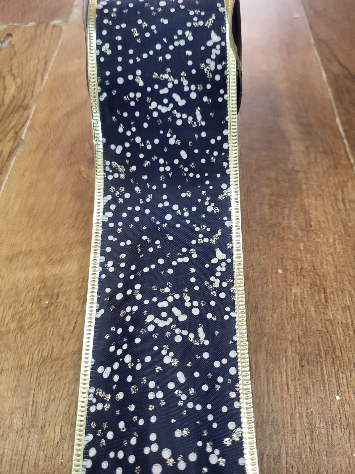 2.7m approx. roll of navy/champagne gold glitter/white spotted wired ribbon image 0