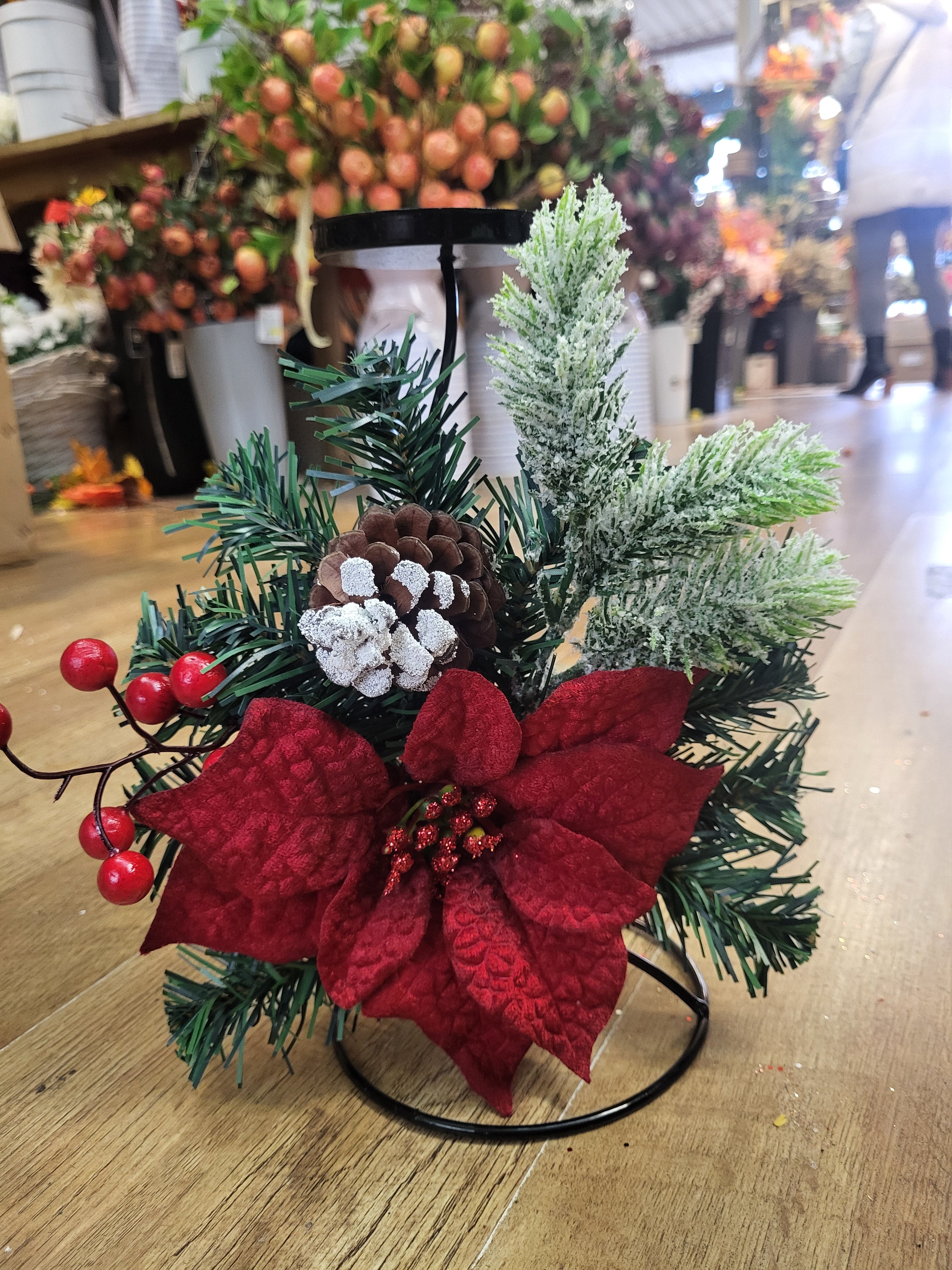 Red poinsettia and snowy foliage decorated metal candle holder image 2