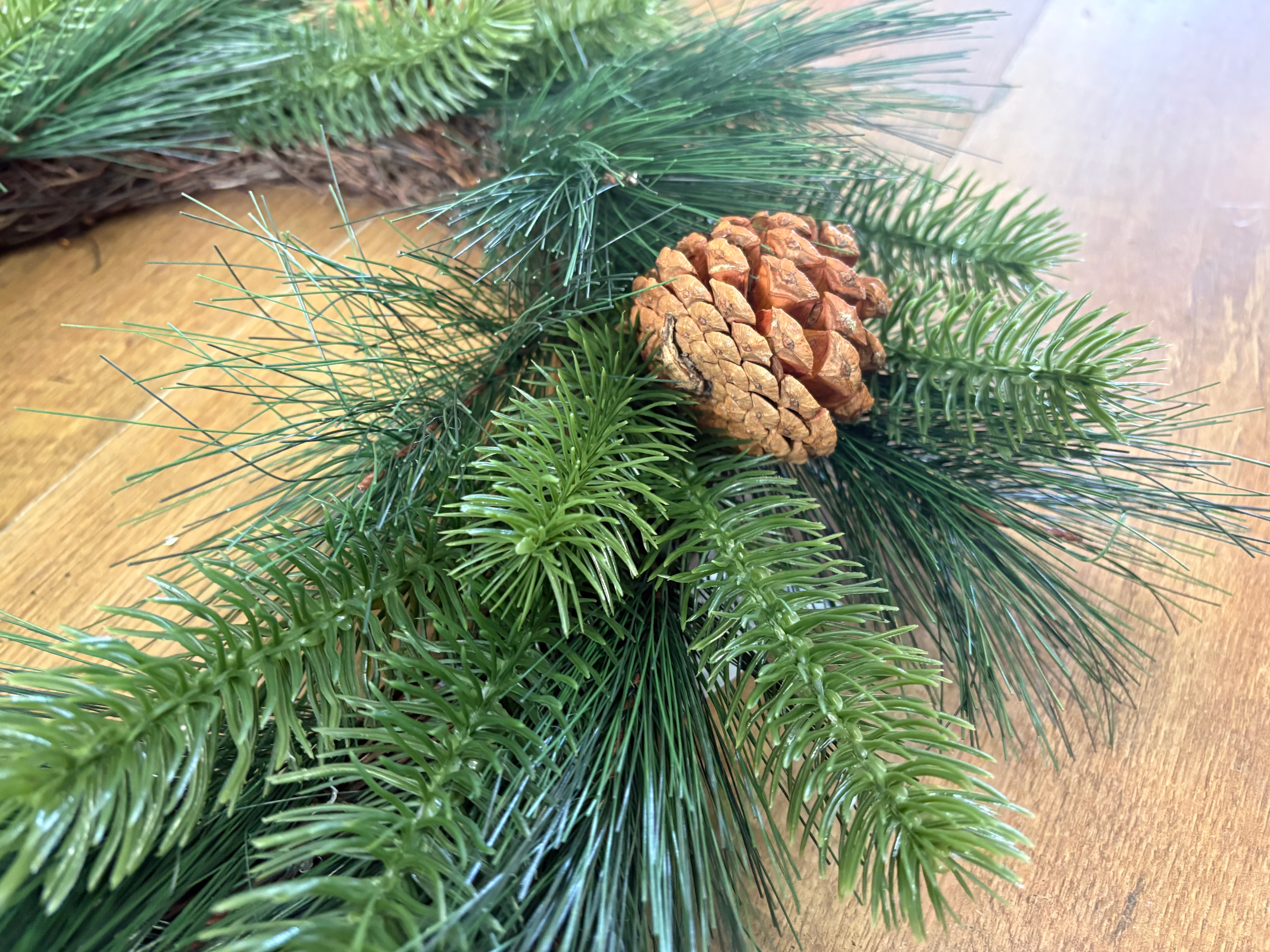 55cm mixed pine and spruce with cones wreath on grapevine base
