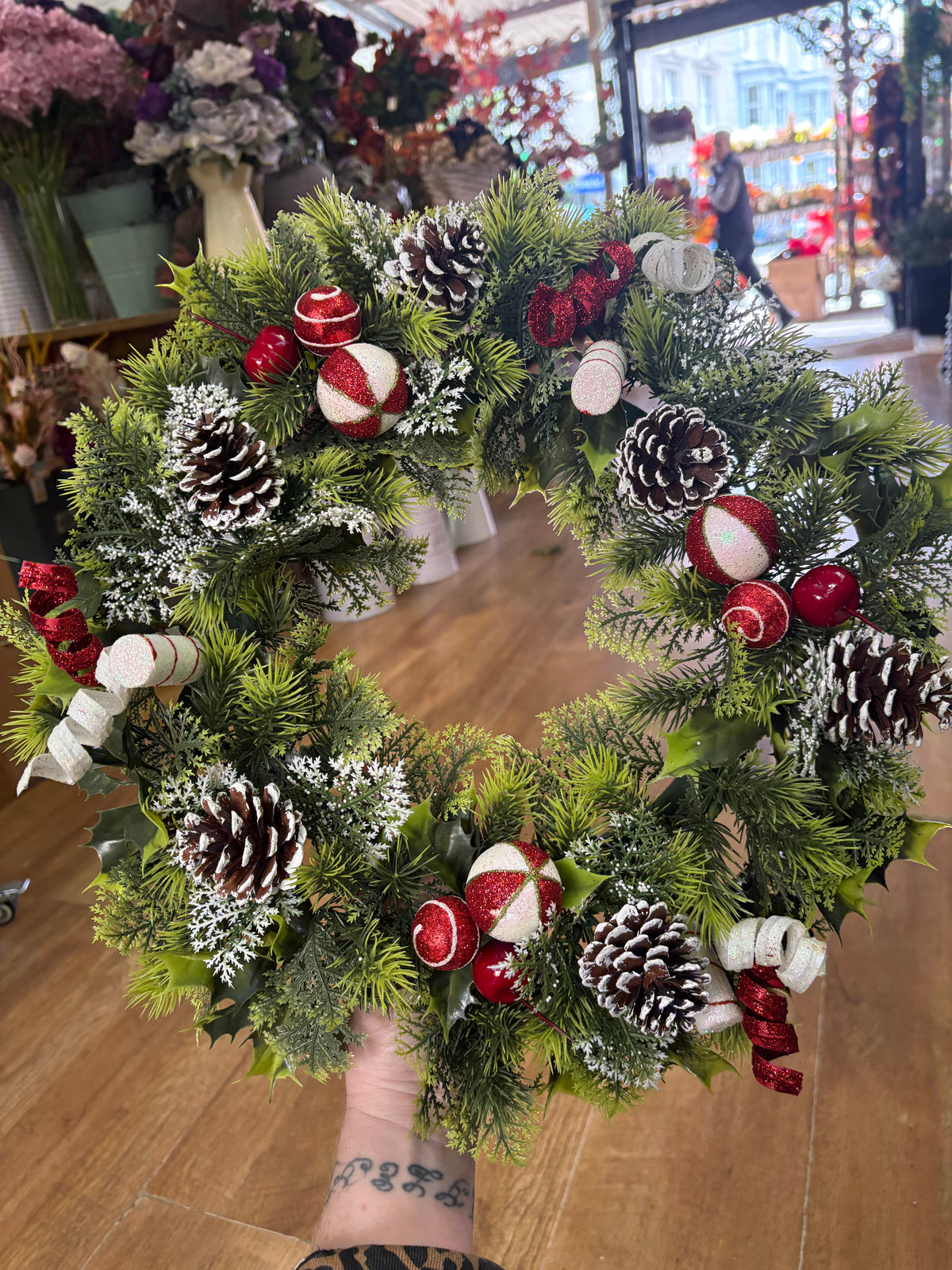 18” wreath with candy baubles, swirls and cones