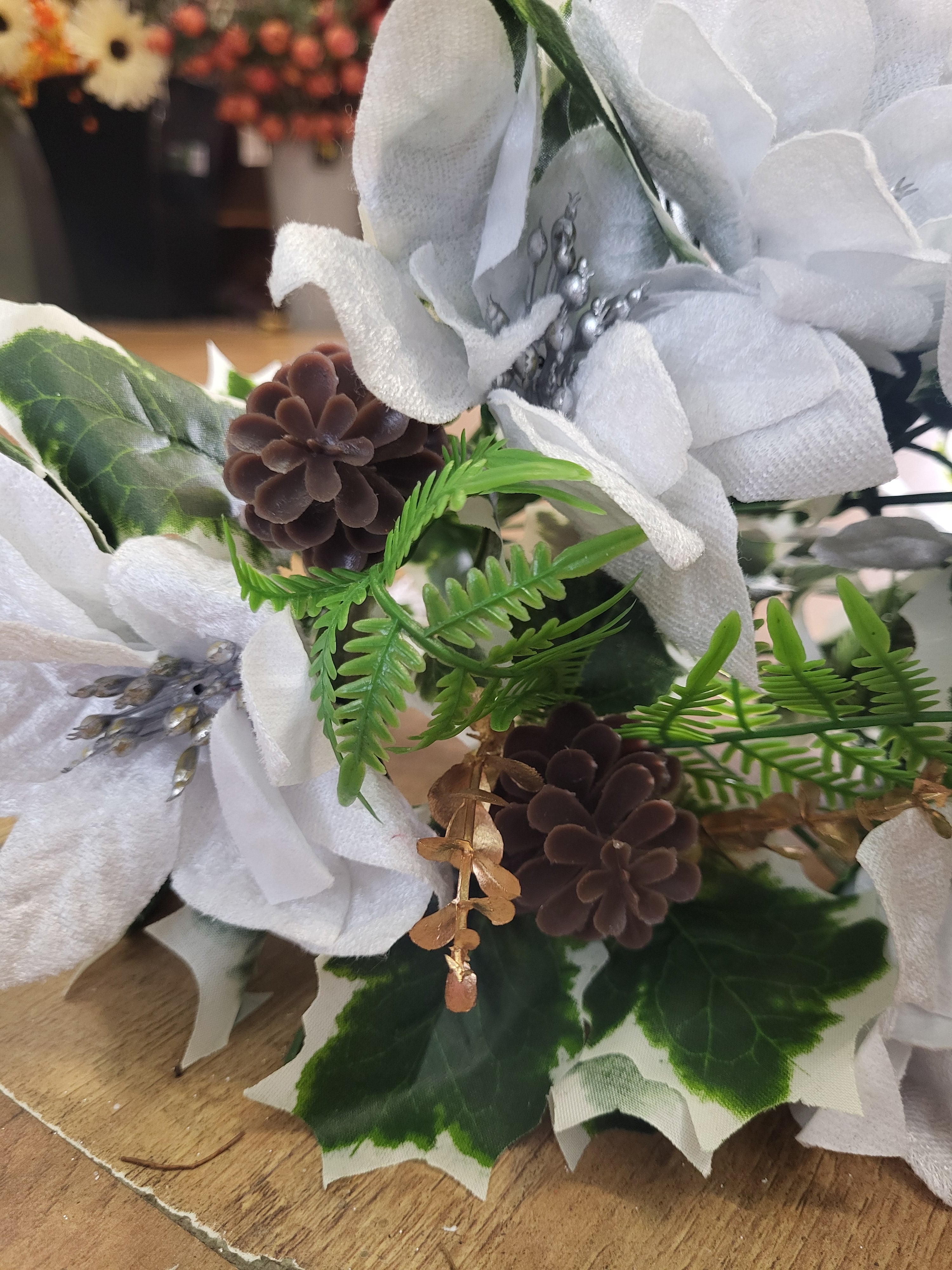 Large white velvet poinsettia and cone bouquet  image 1
