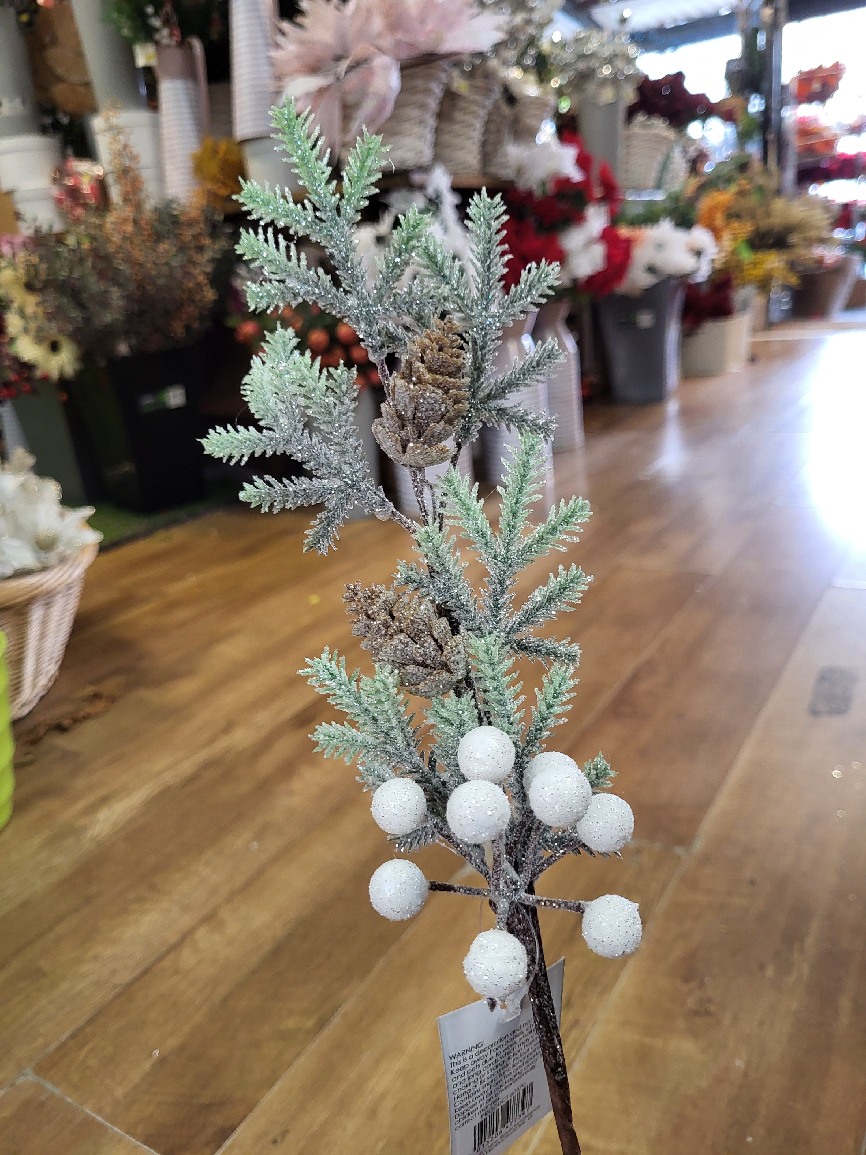 Frosted foliage stem with cones and white berries  image 1