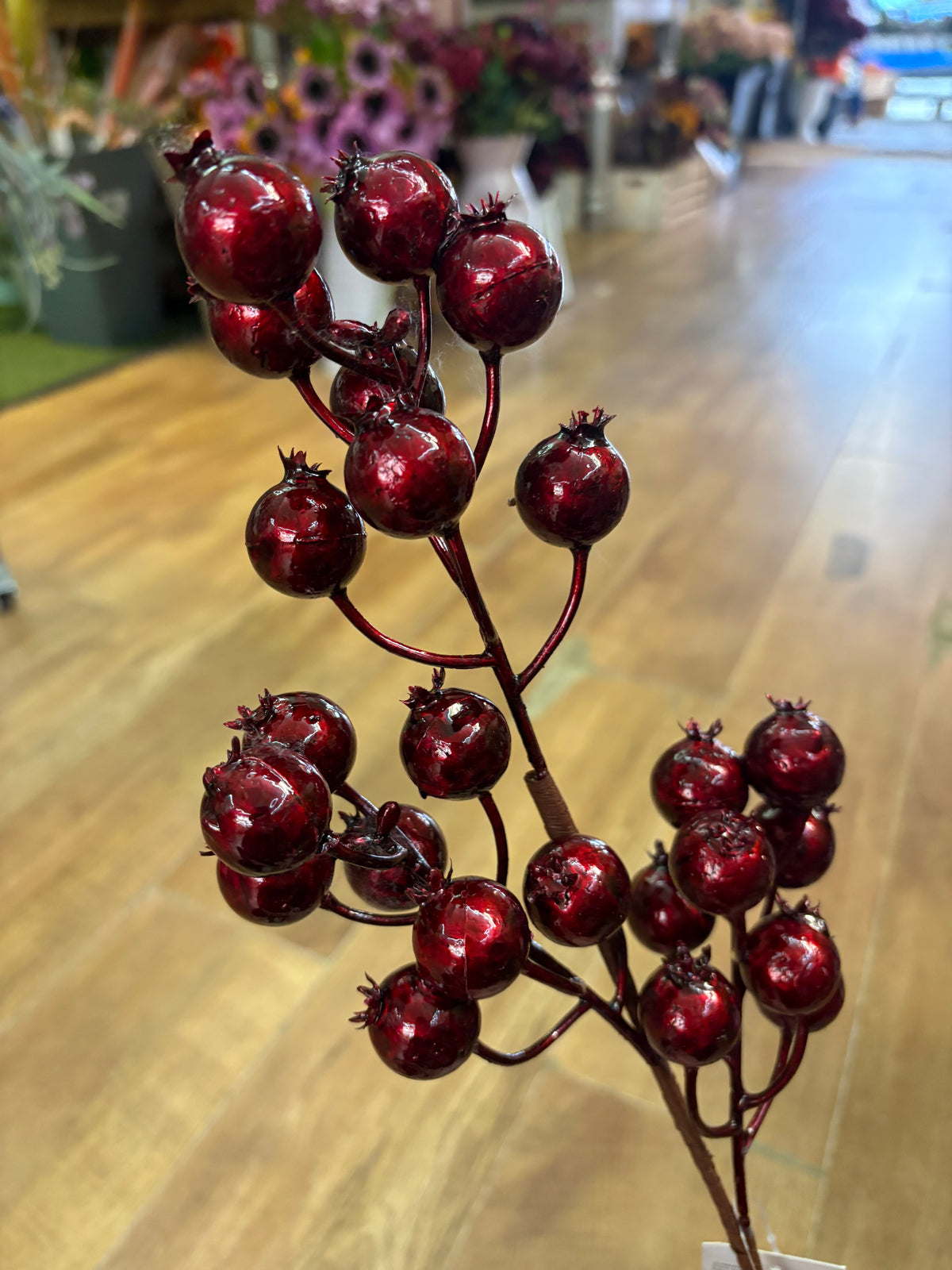 Long stem metallic burgundy rose hip spray