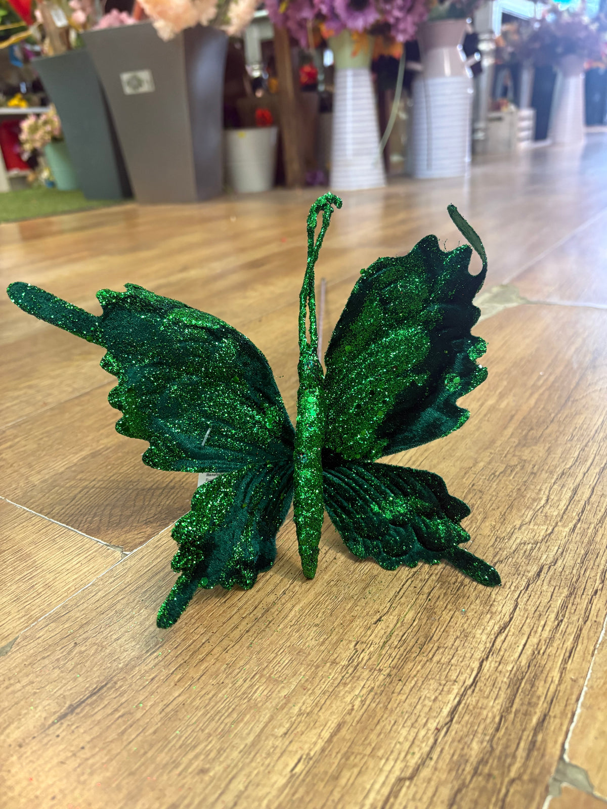 Long stem green velvet and glitter butterfly