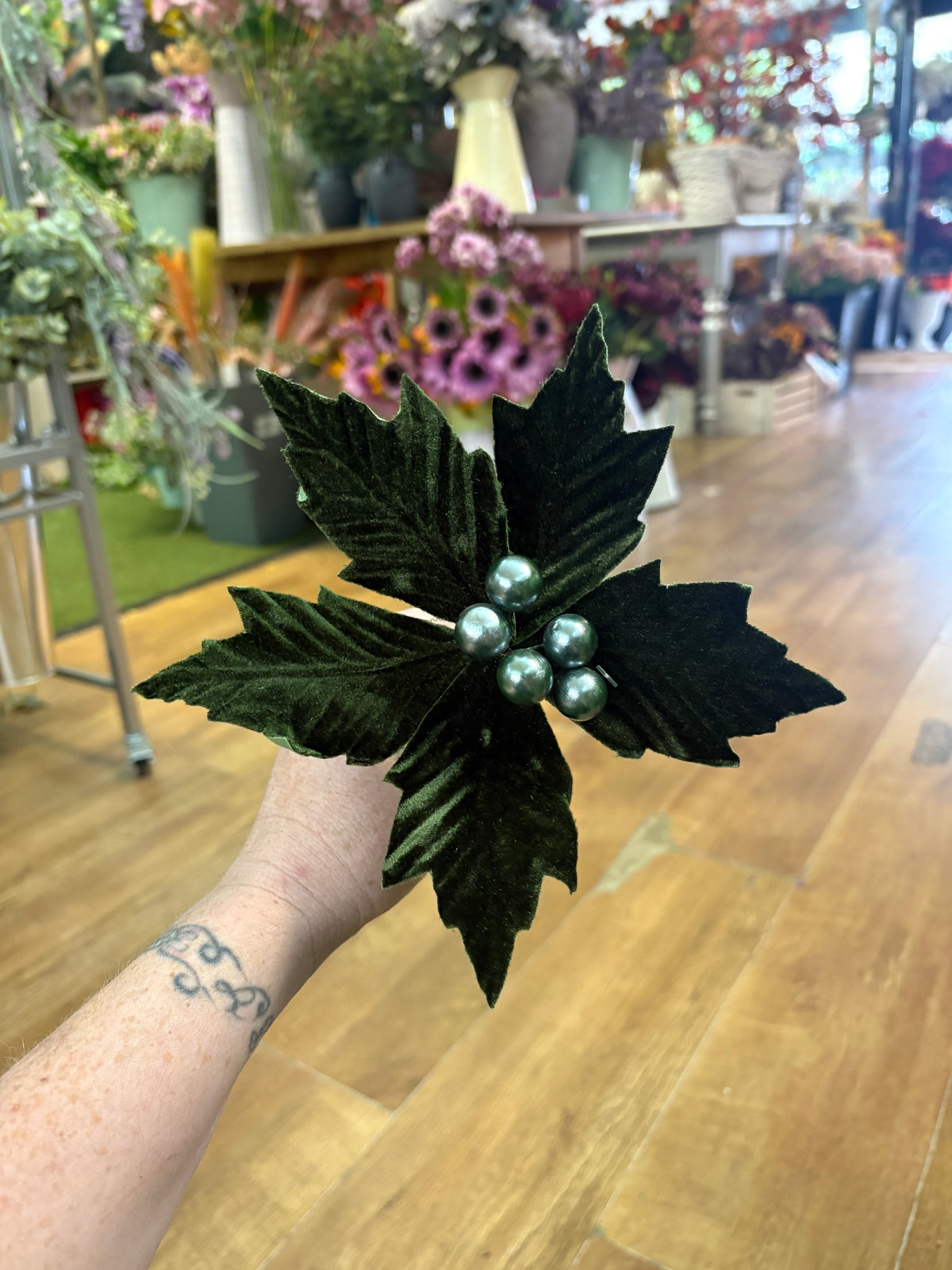 Small green velvet poinsettia pick