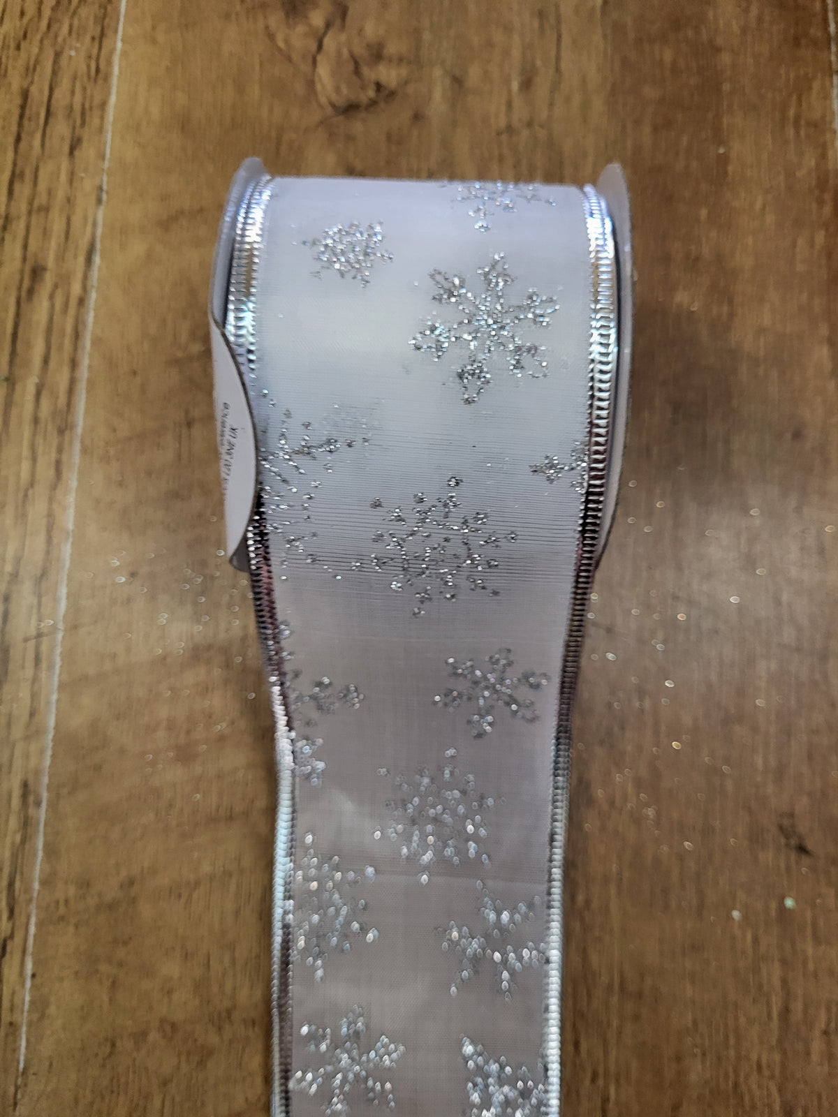 2.7m approx. roll of white/silver snowflake wired ribbon image 0