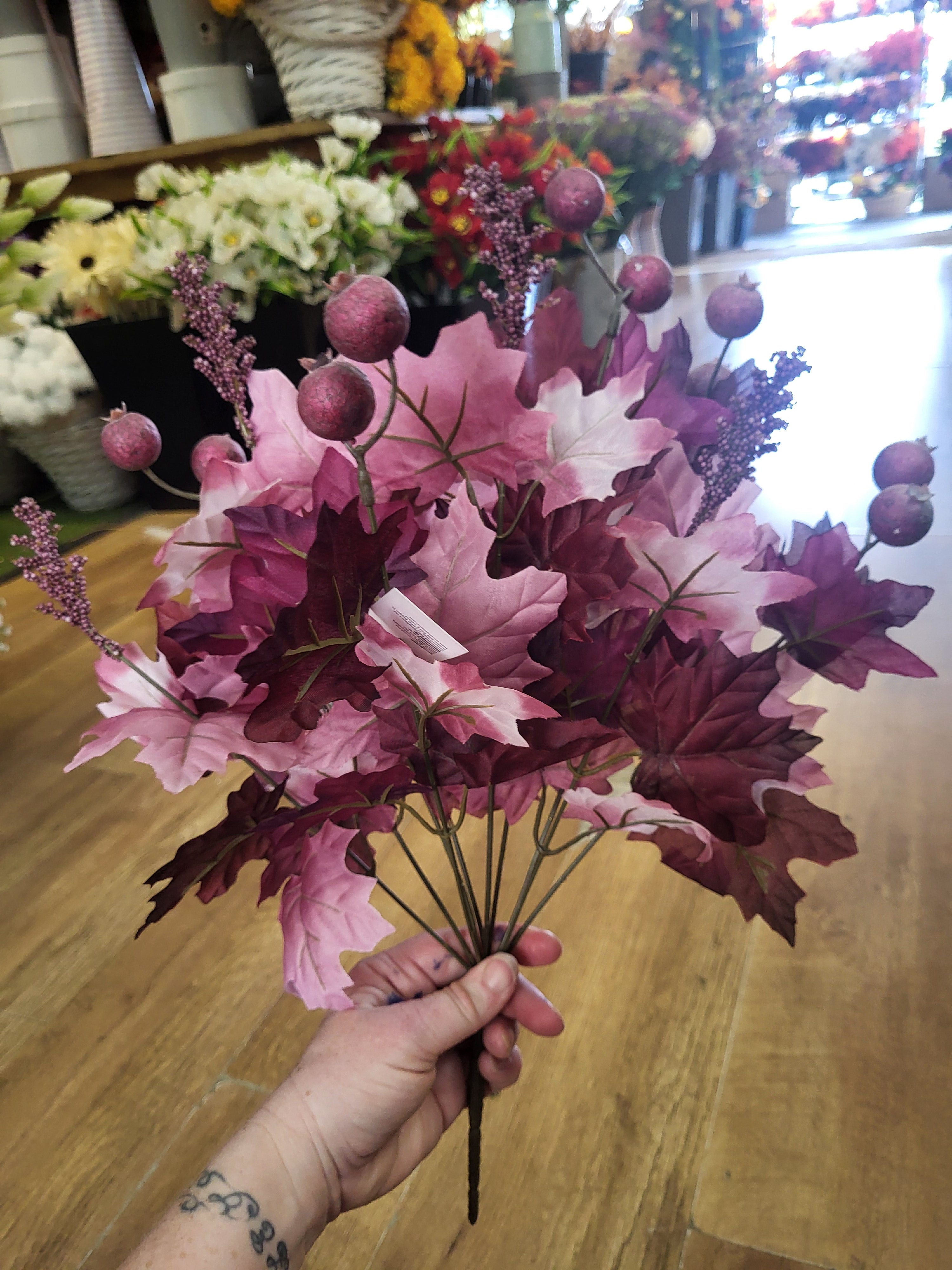 Large purple/mauve autumn maple leaf and berry bunch image 0