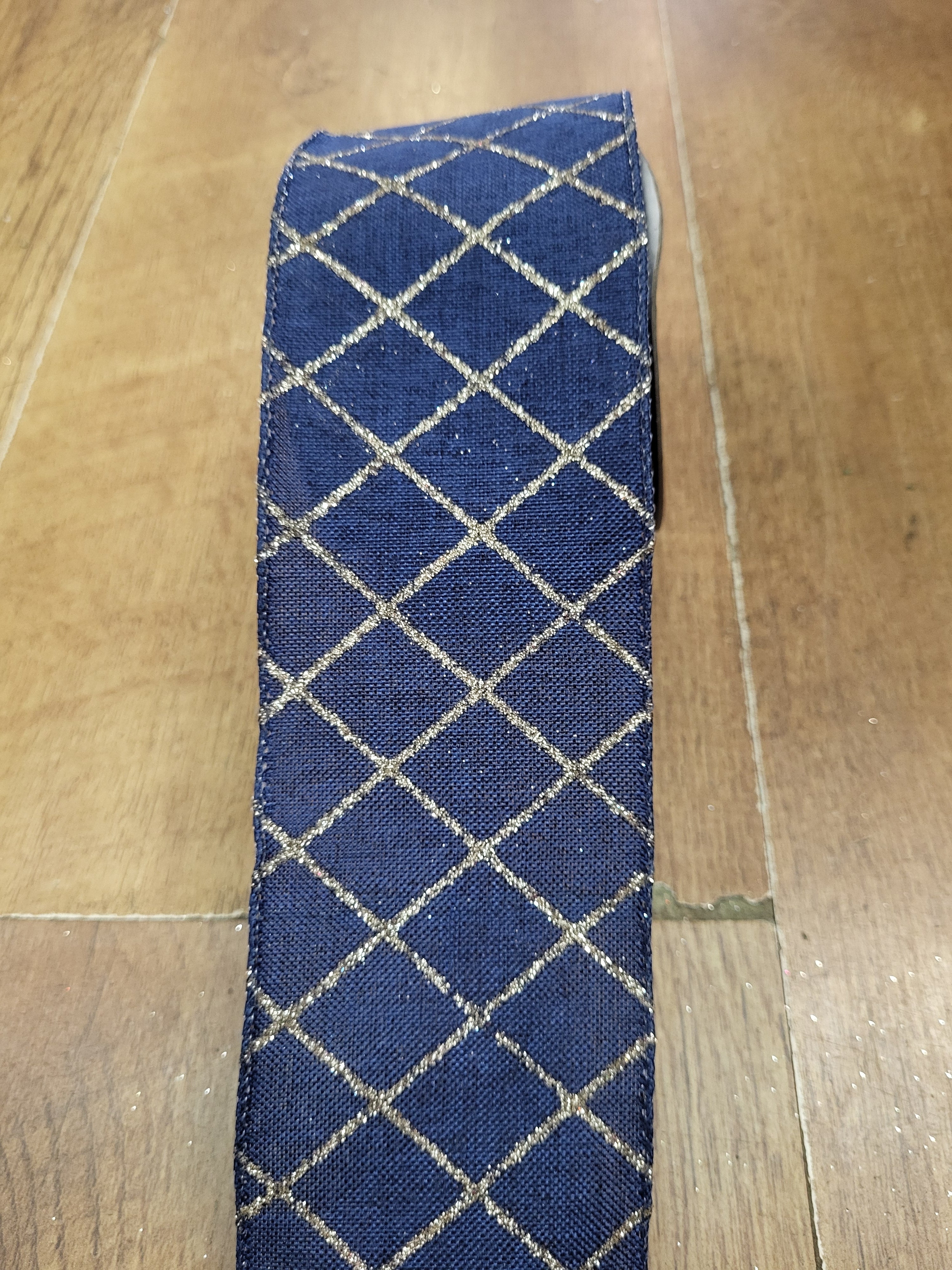 2.7m approx. roll of navy/champagne glitter criss cross wired ribbon image 0