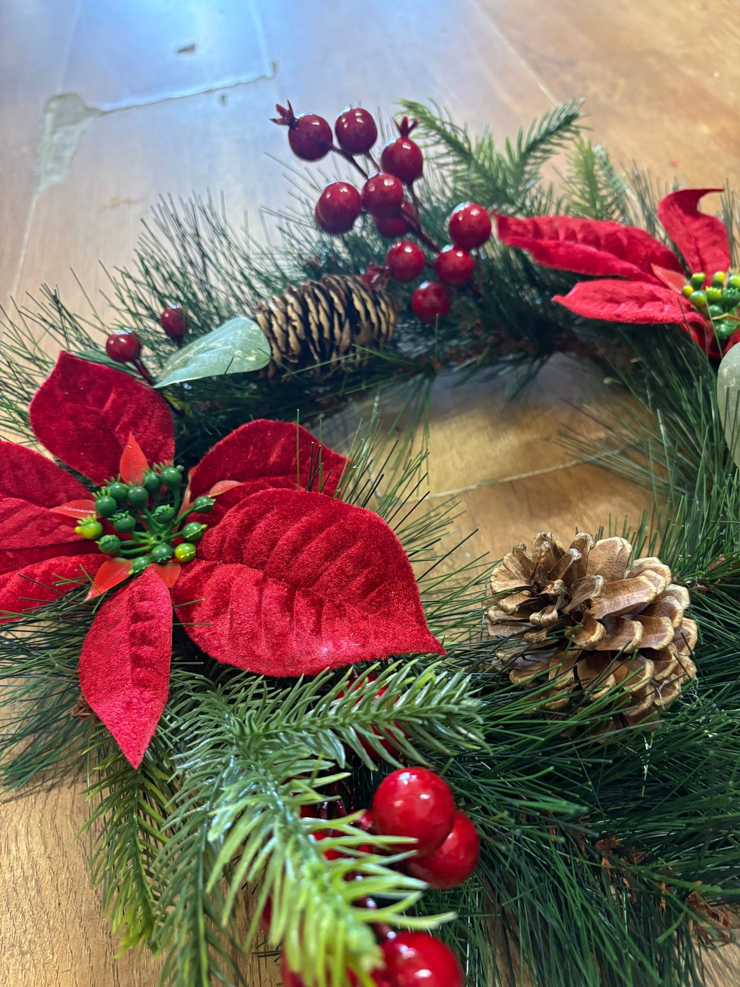 Poinsettia and red berry wreath (40cm from tip to tip)