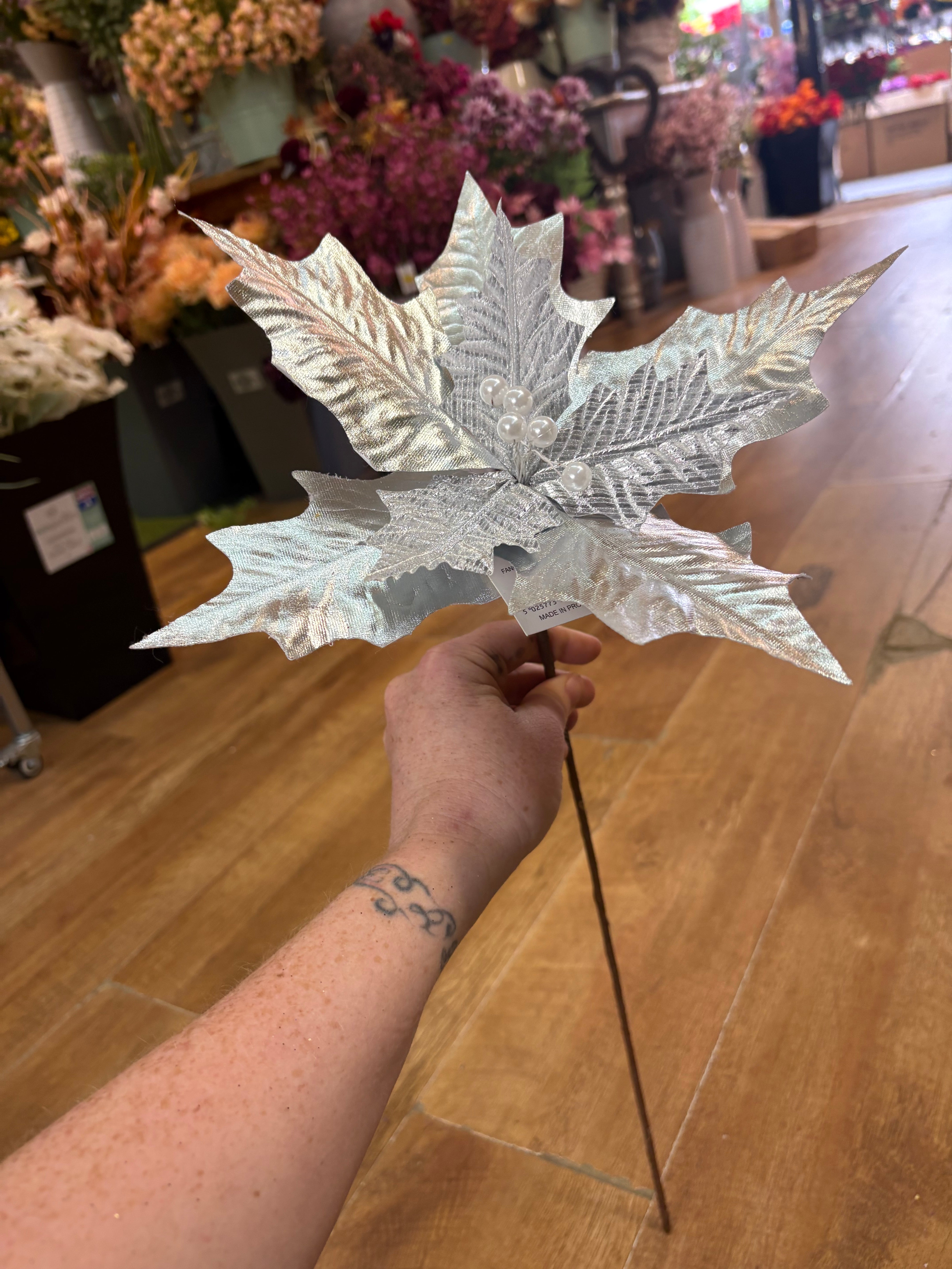 Single silver metallic and crinkle petal poinsettia