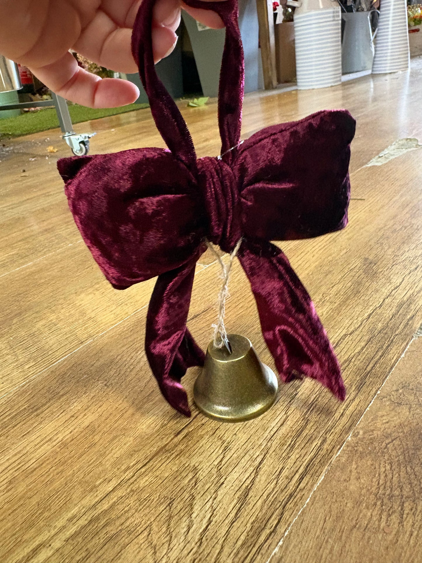 Small hanging burgundy velvet bow and Christmas bell