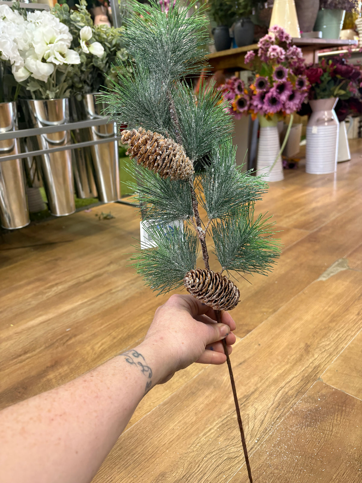 Long stem frosted and glittered winter foliage with cones