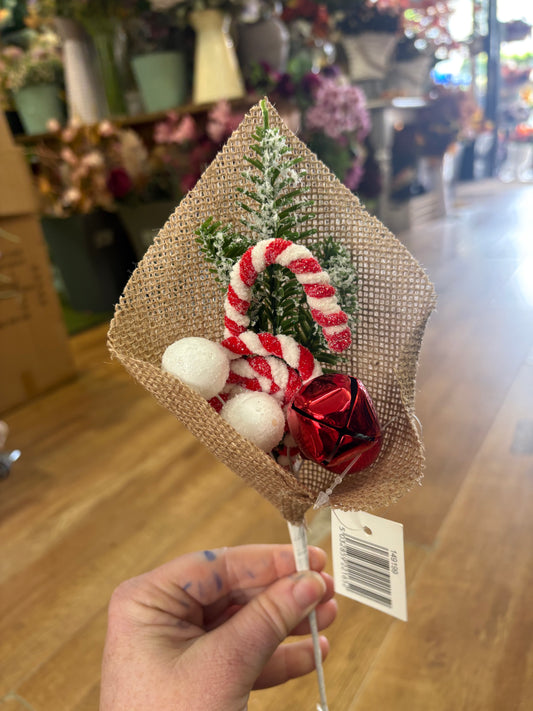 Candy cane and bell pick wrapped in hessian