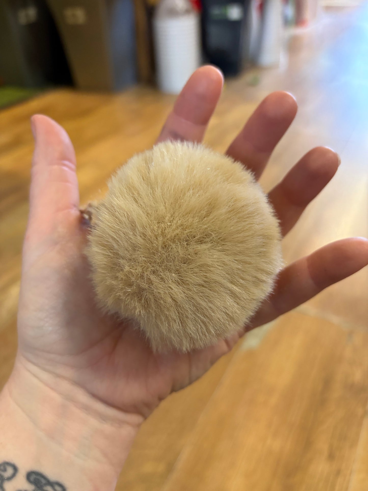 Small beige fluffy bauble