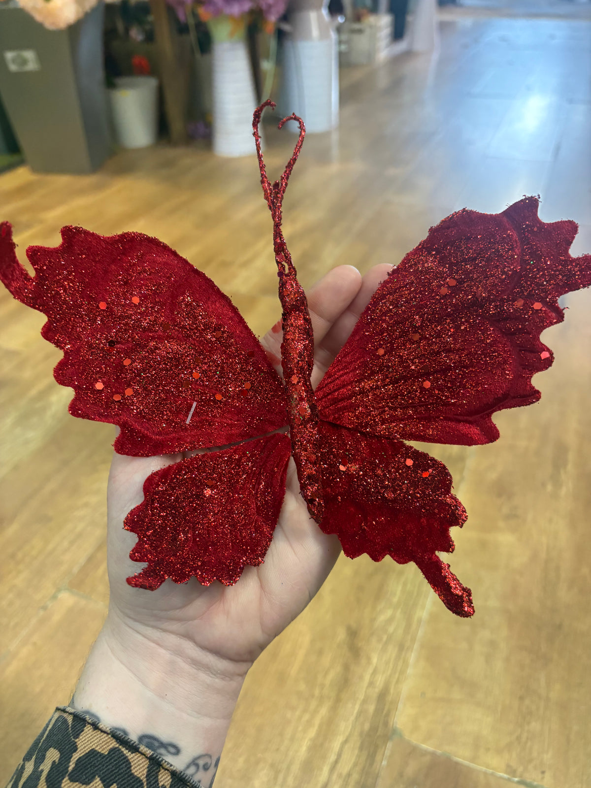 Long stem red velvet and glitter butterfly