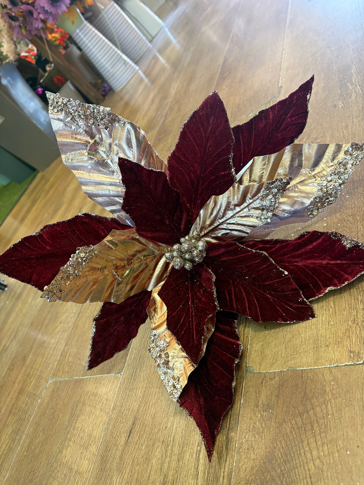 Large burgundy velvet and metallic gold poinsettia
