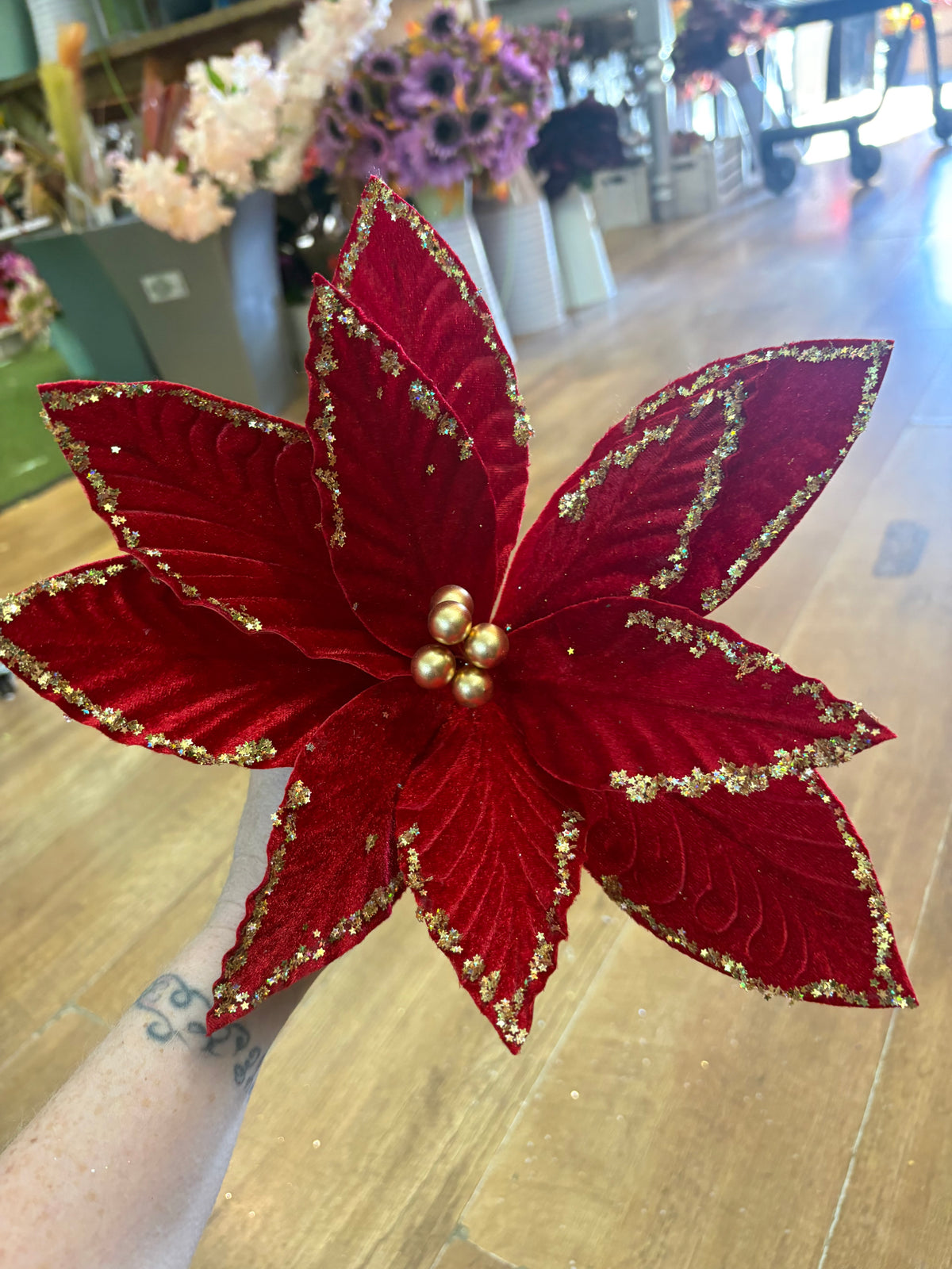 Red velvet and gold glittered poinsettia