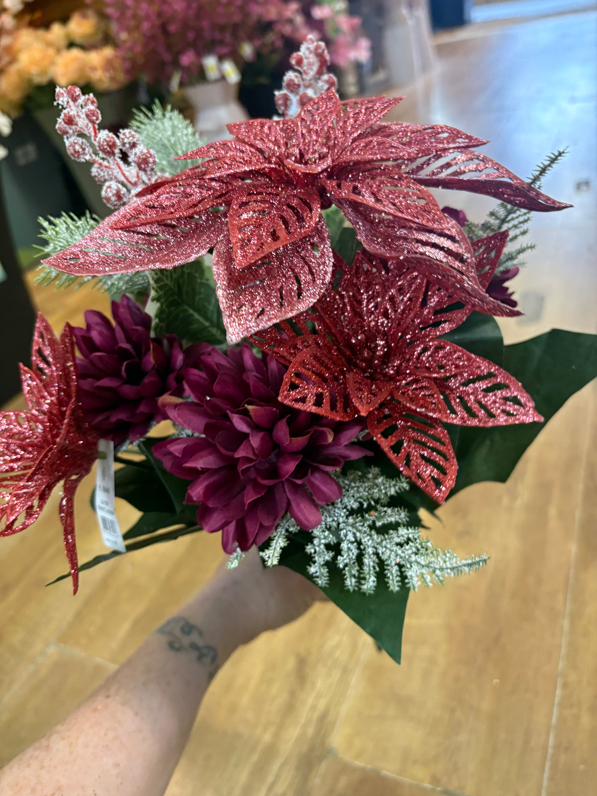Pink glittered poinsettia and purple chrysanthemum bouquet