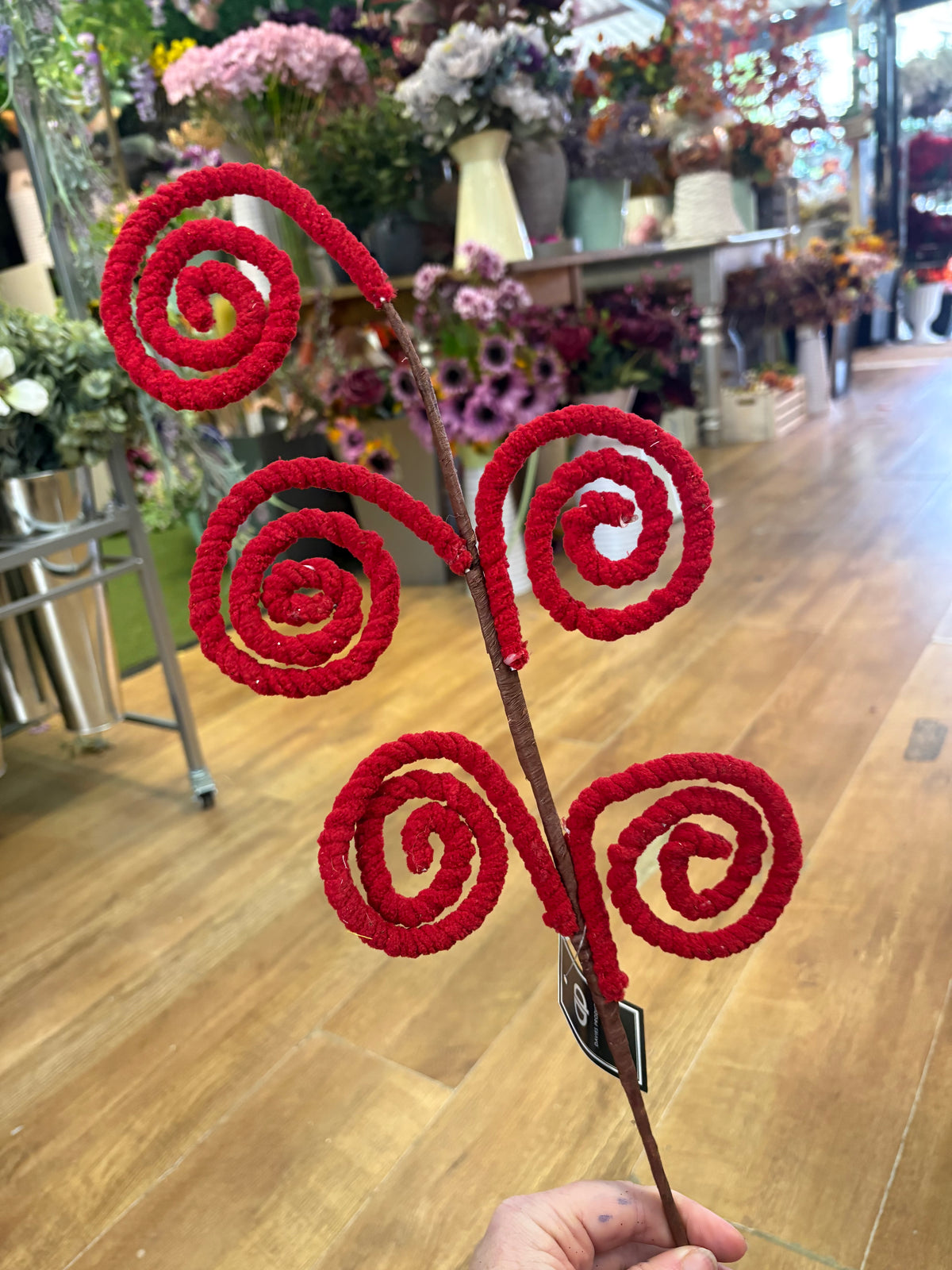 Long stem fluffy red swirly stem