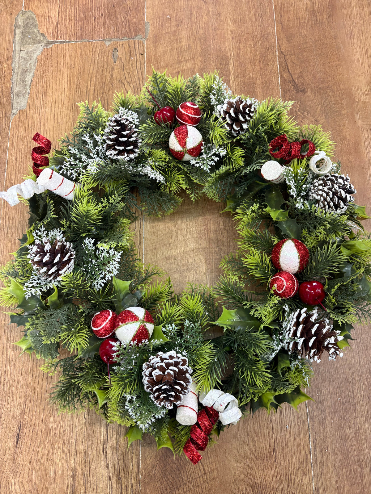 18” wreath with candy baubles, swirls and cones
