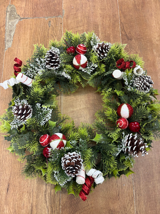 18” wreath with candy baubles, swirls and cones