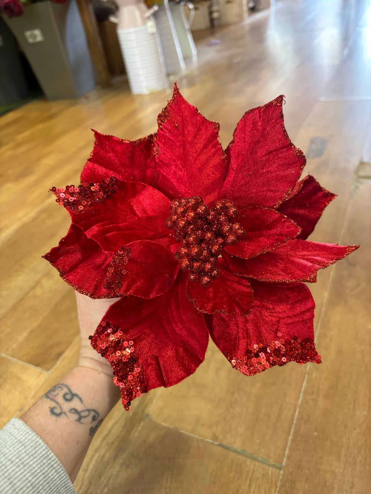 Clip on red velvet and glittered poinsettia