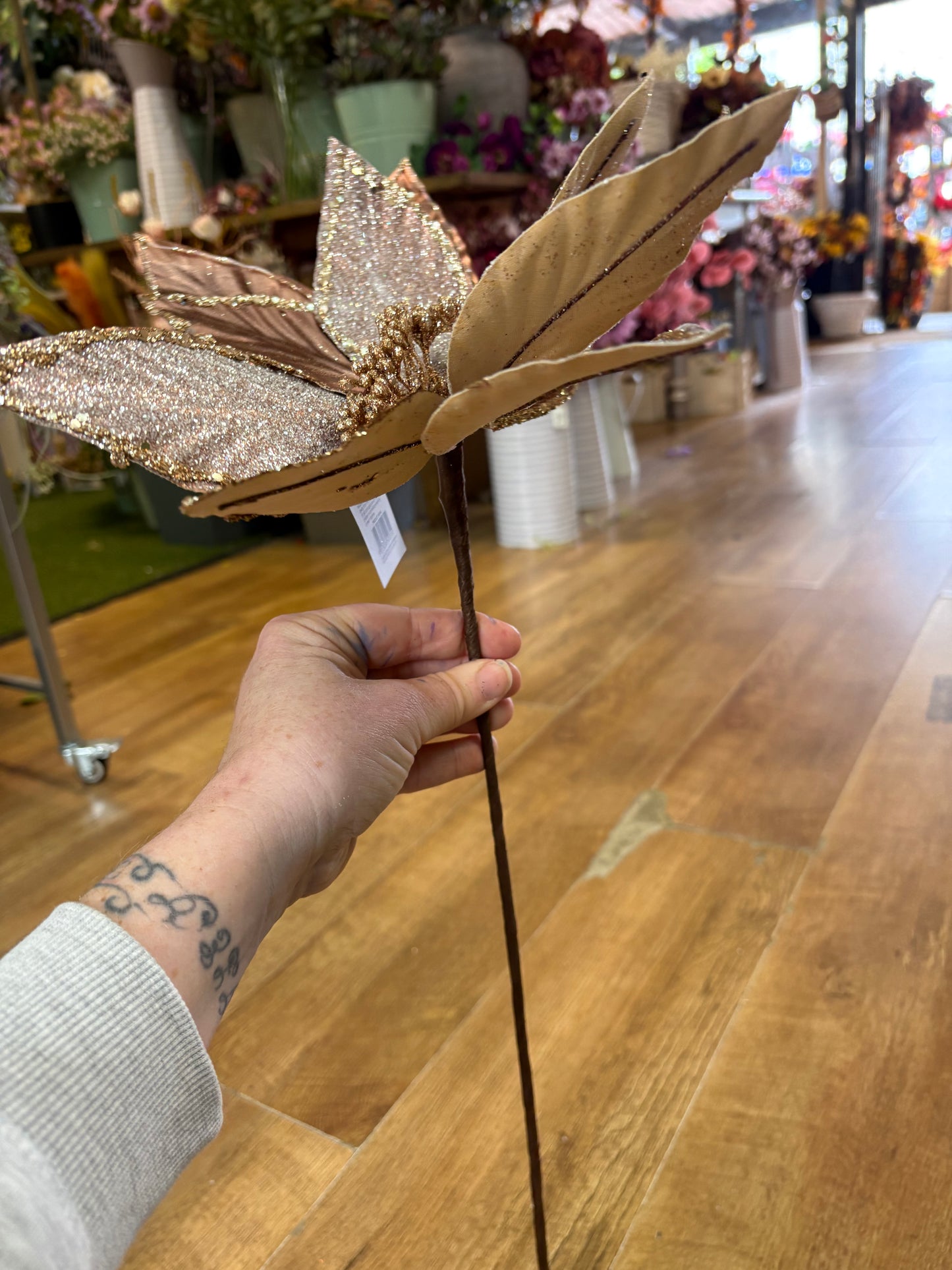 Large rose gold metallic and glittered single long stem poinsettia