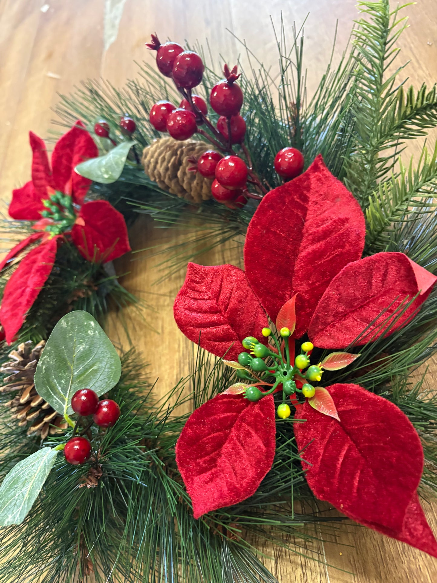 Poinsettia and red berry wreath (40cm from tip to tip)