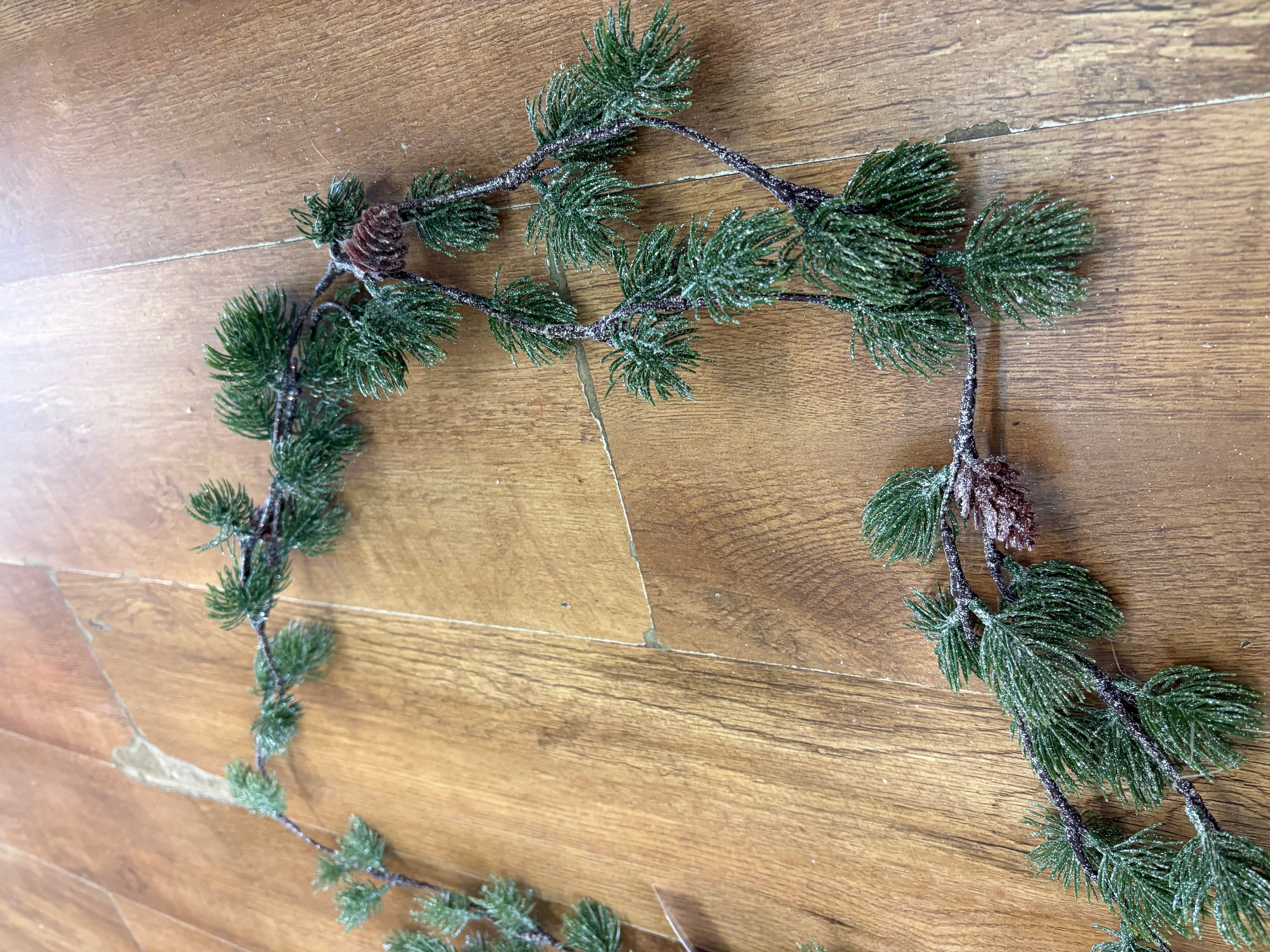 Glittered thistle greenery and miniature cone garland