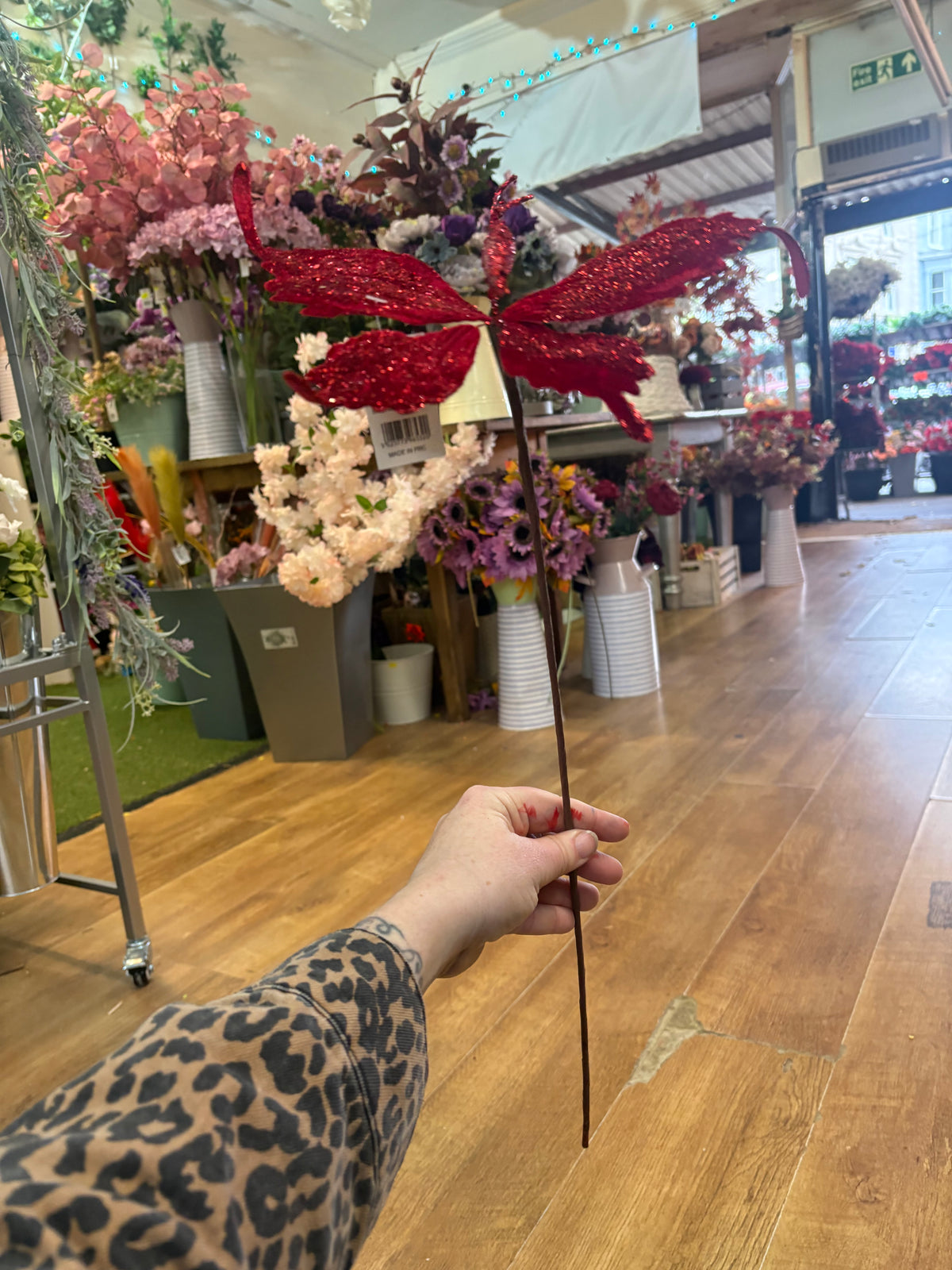 Long stem red velvet and glitter butterfly