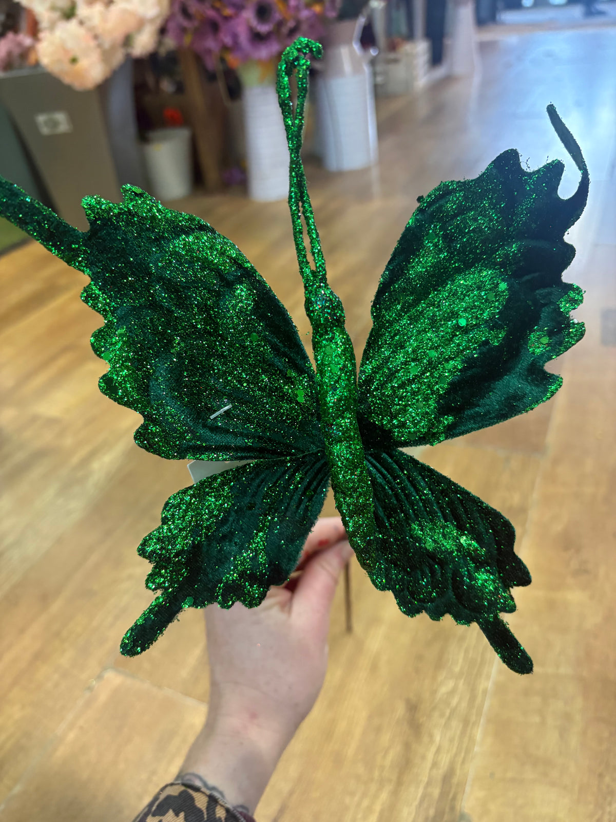 Long stem green velvet and glitter butterfly